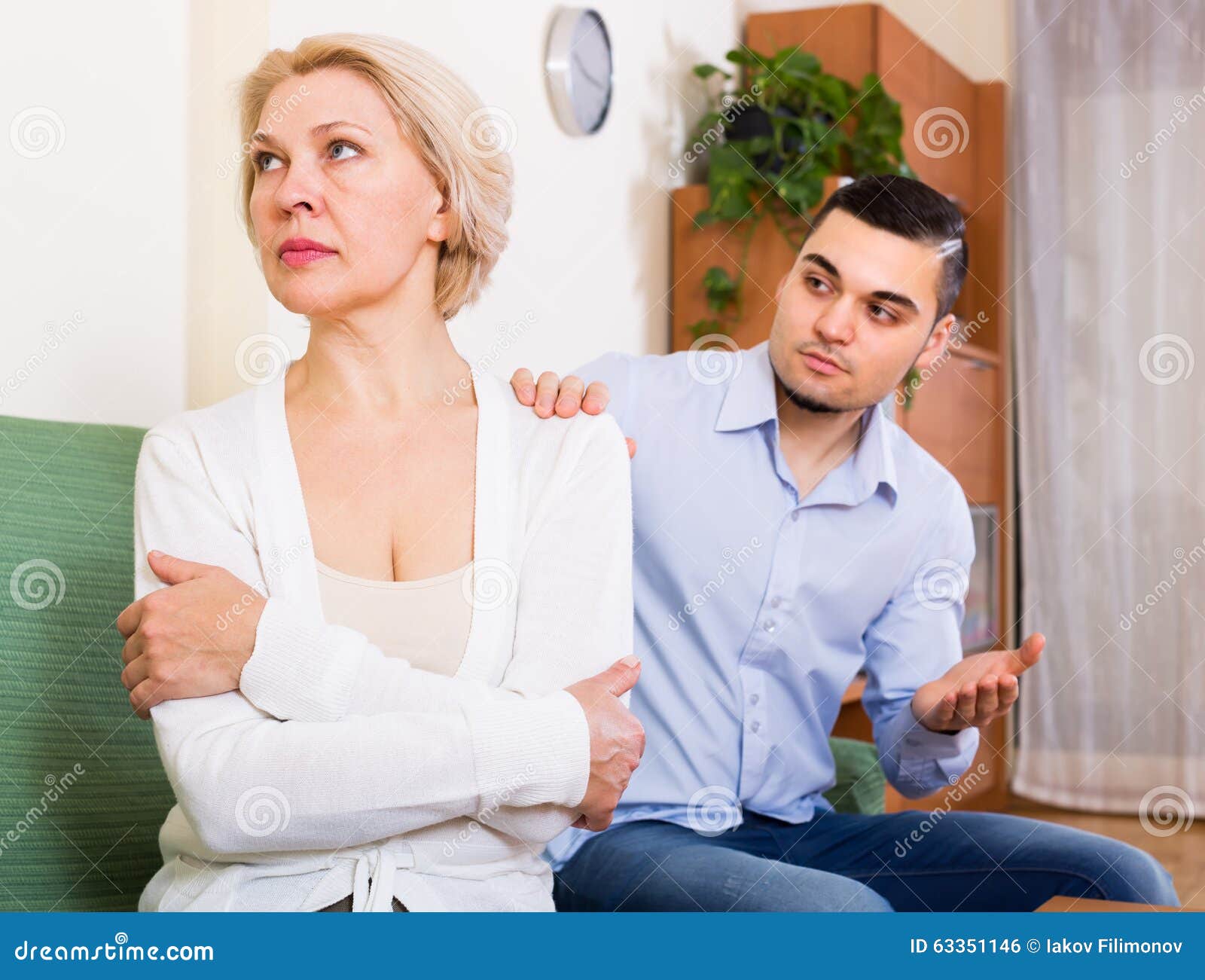 Conflict Of Aged Woman And Young Guy Stock Photo I
