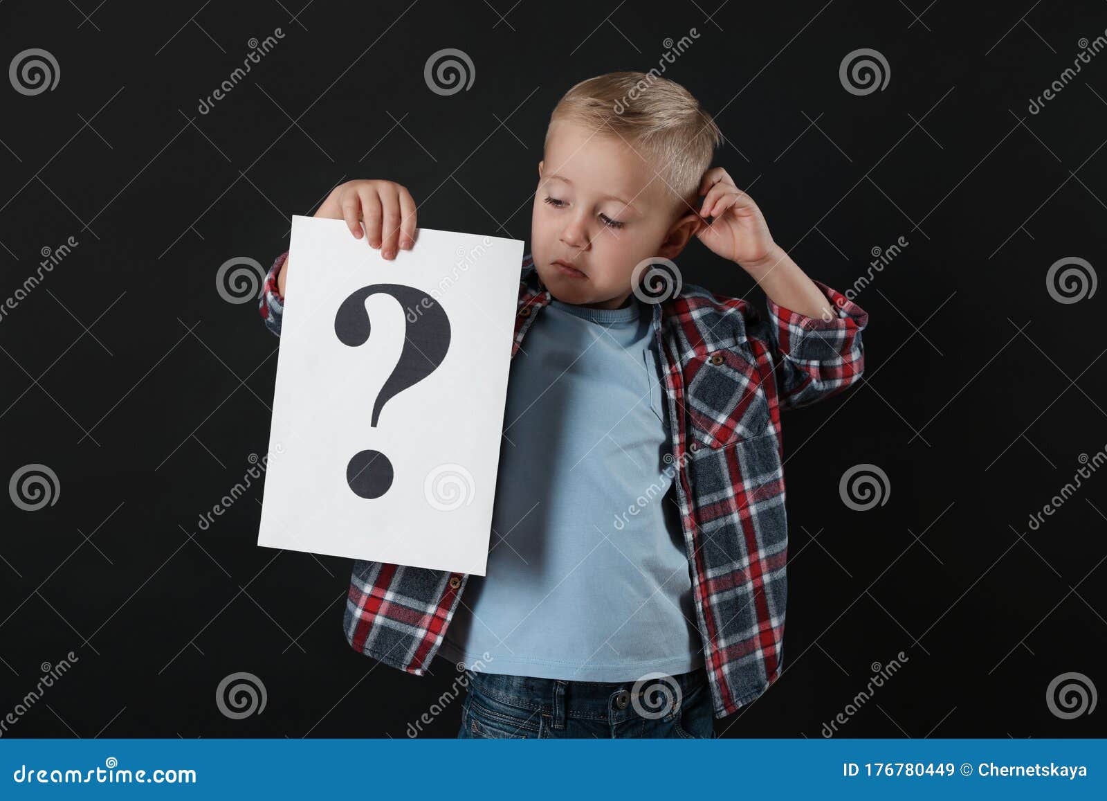 Confused Boy Holding Sheet of Paper with Question Mark on Background ...