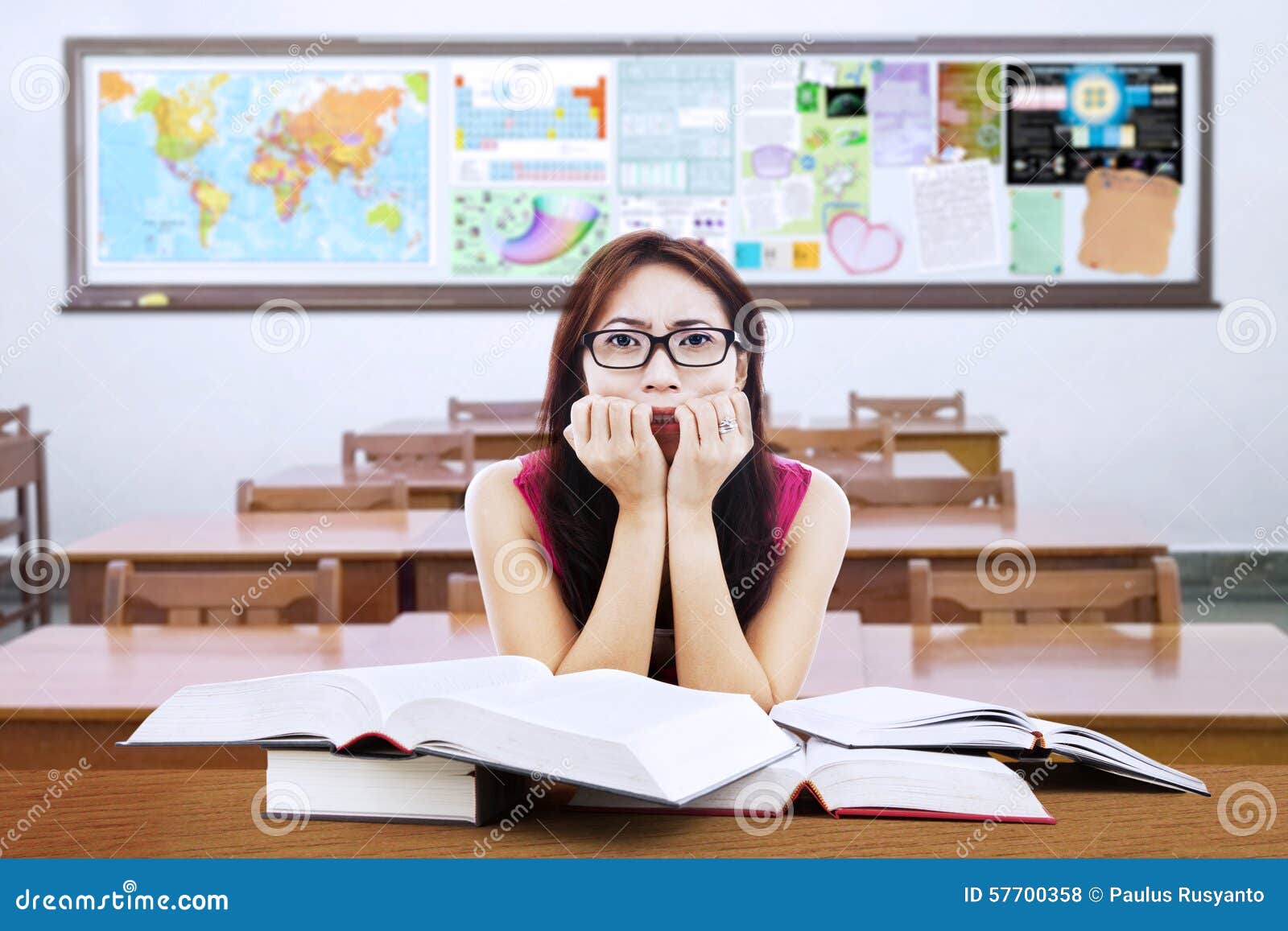 Confused Brunette Student With Books In Class Stock Photo ...