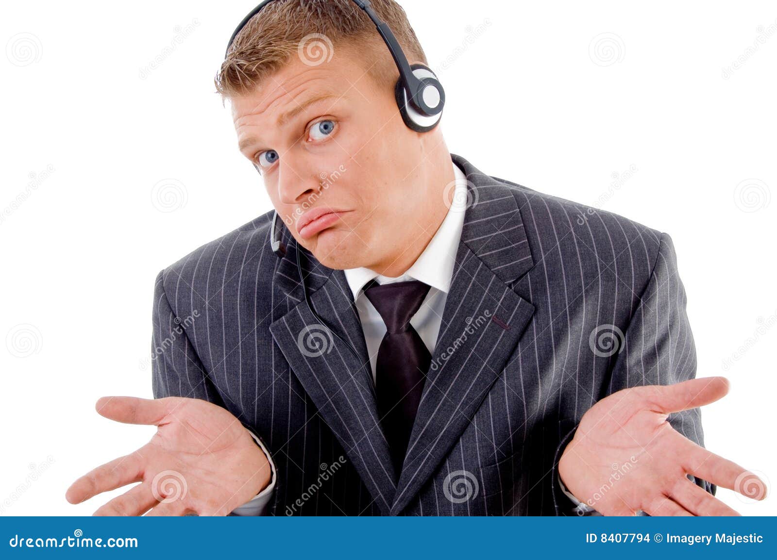Confused Businessman Posing With Headset Stock Photo - Image: 8407794