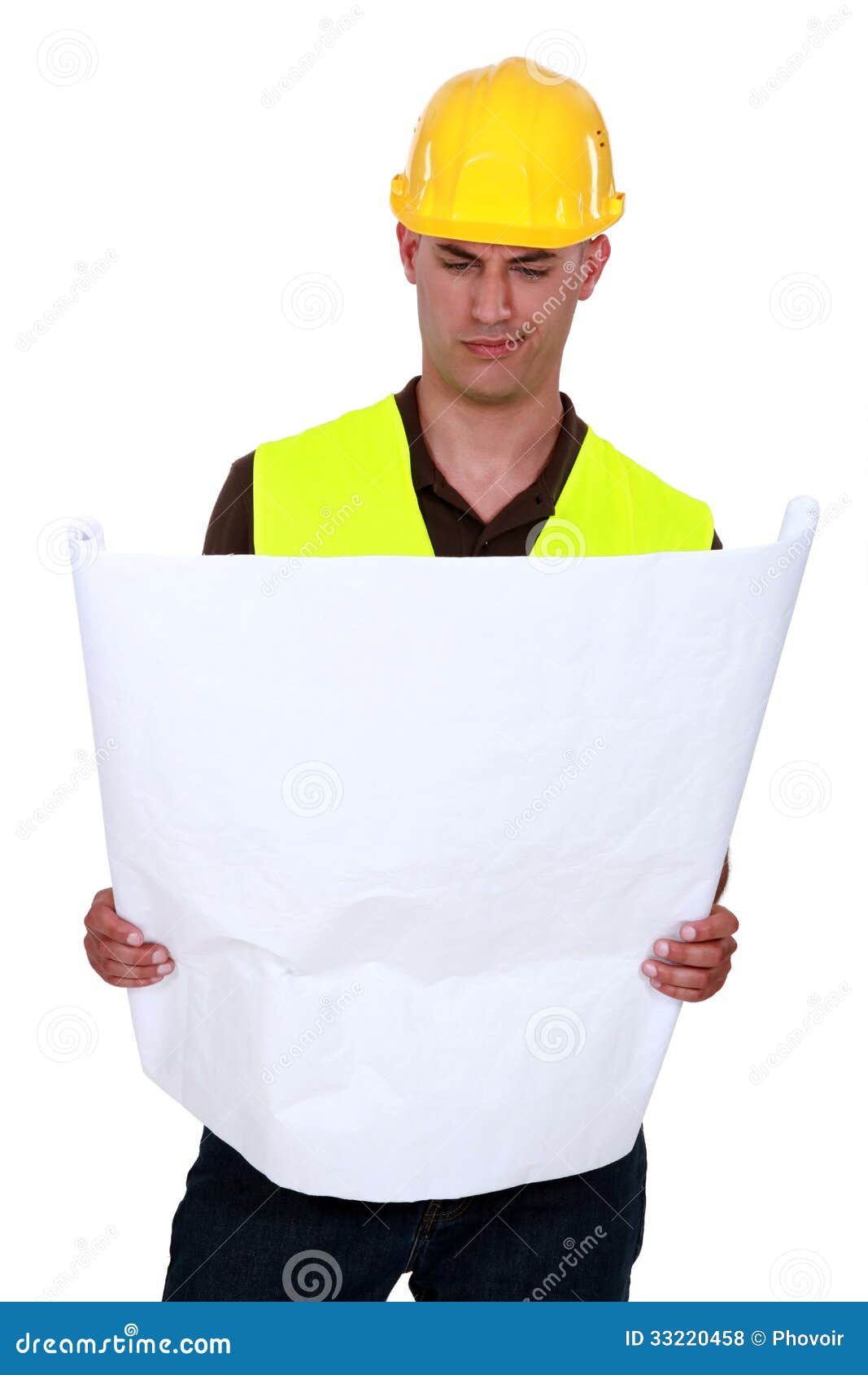 Confused tradesman looking at a technical drawing