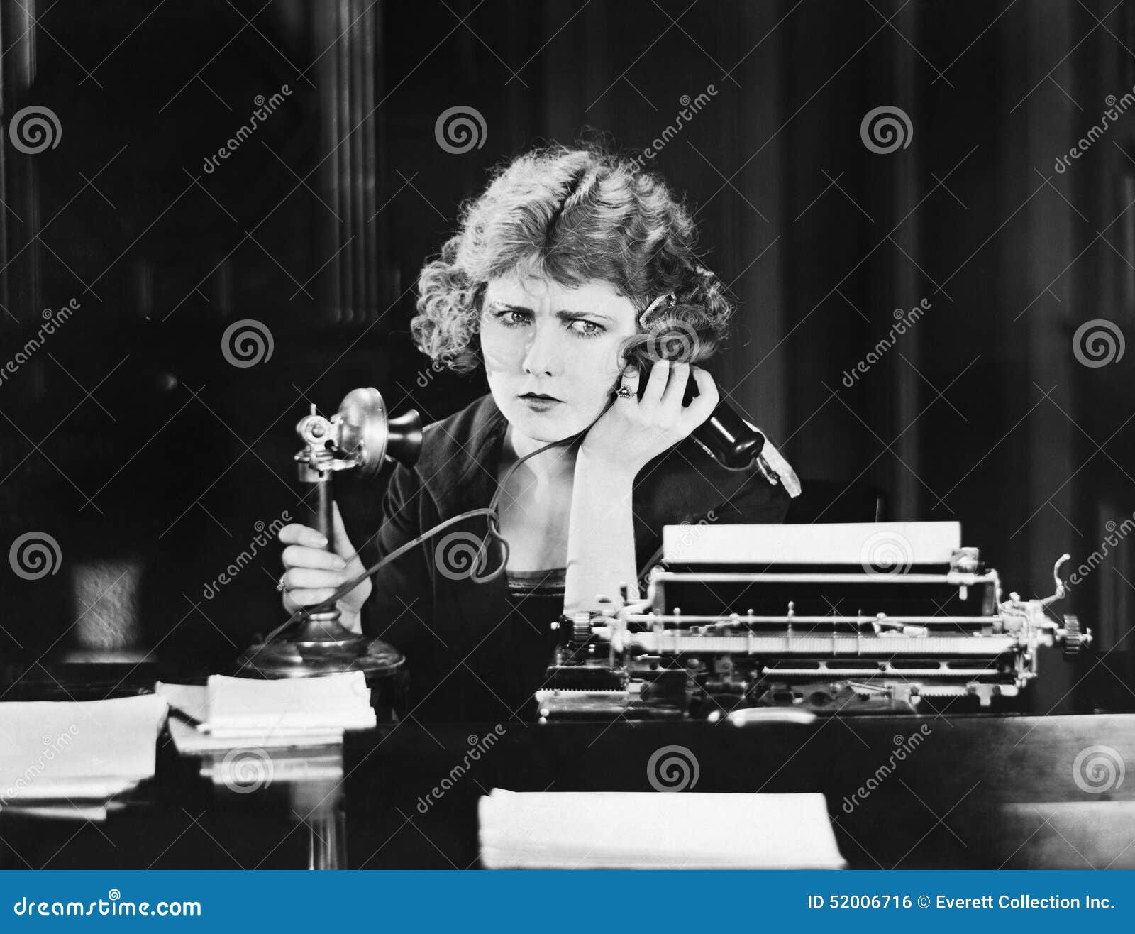 confused woman on telephone