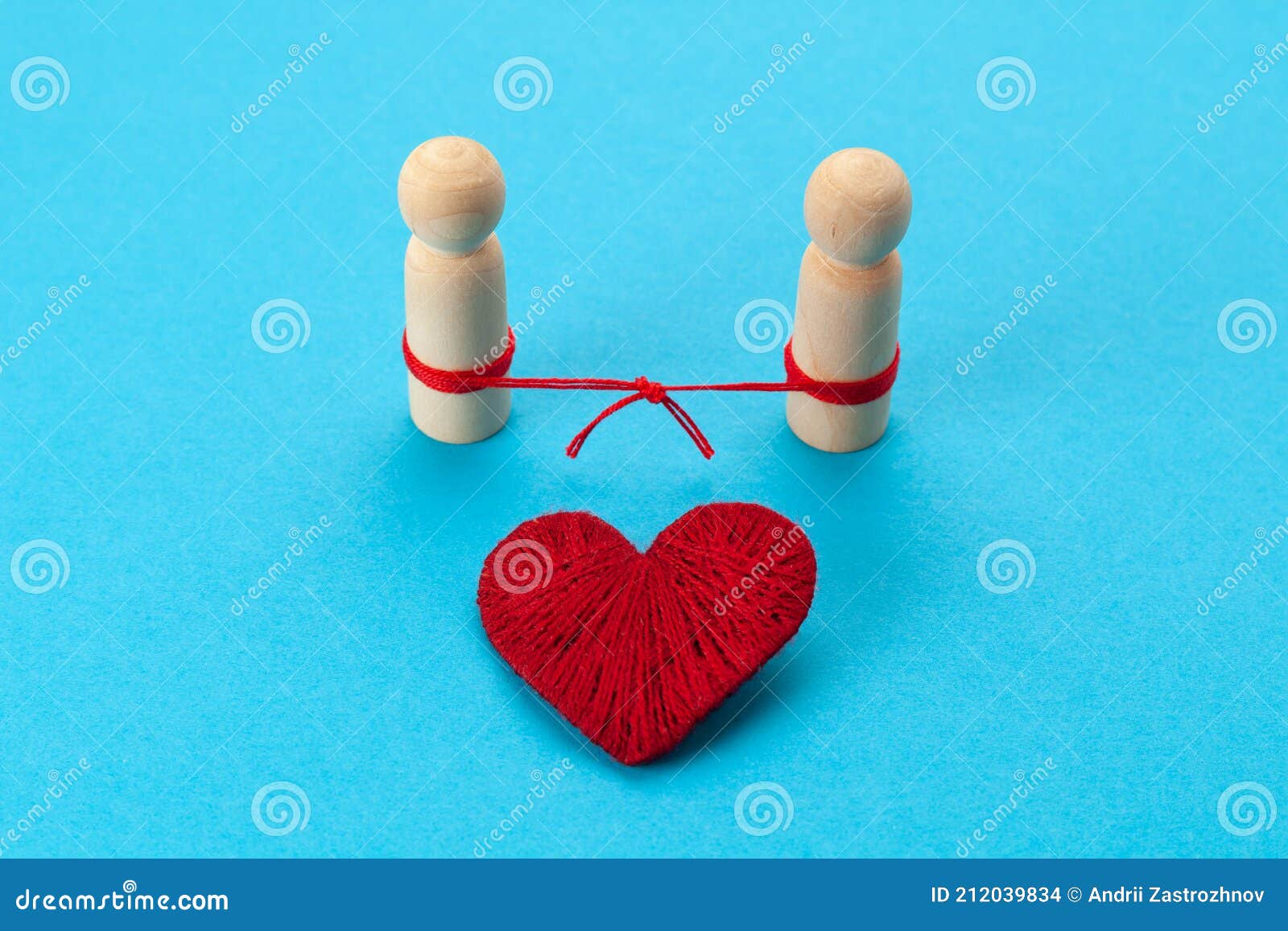 connected figures of people and a red heart on a blue background. restoring broken relationships. successful solution to family