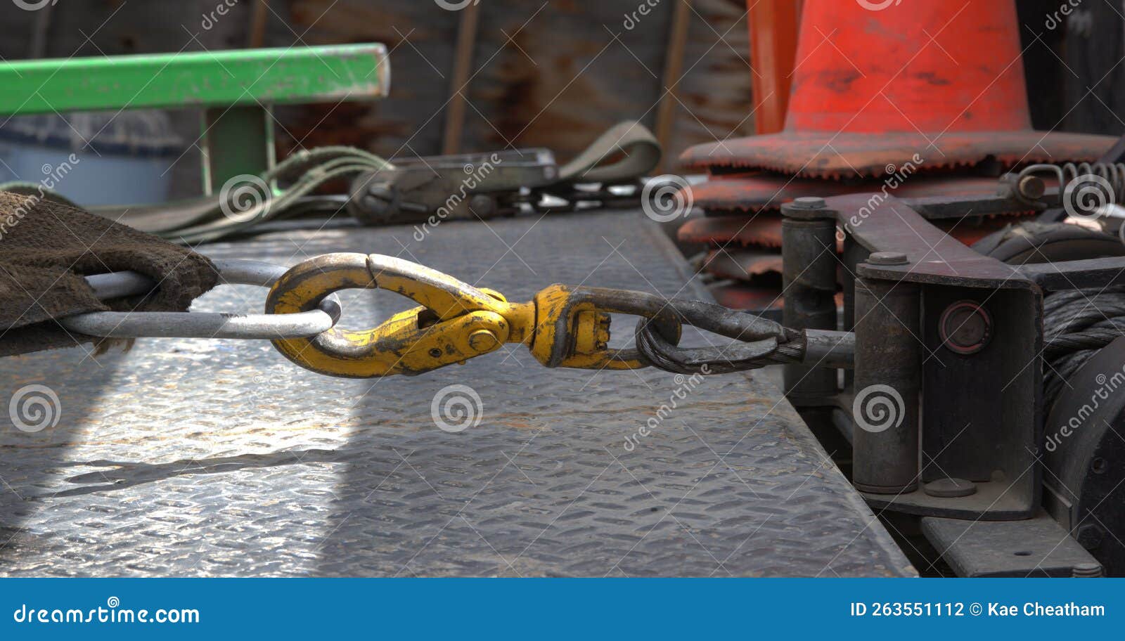 Connection of a Tow Truck Winch To the Cable Attached To an Automobile