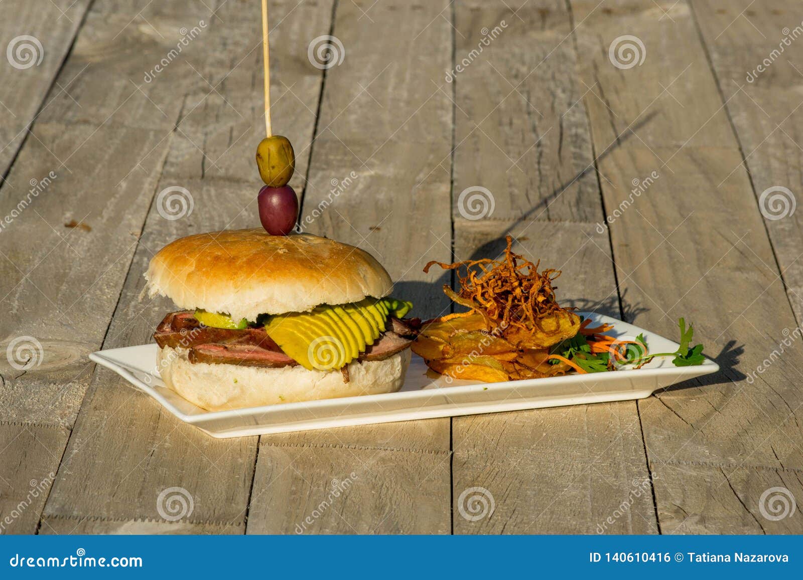 Still Life of a Burger on a Plate Stock Photo - Image of meal, fries ...