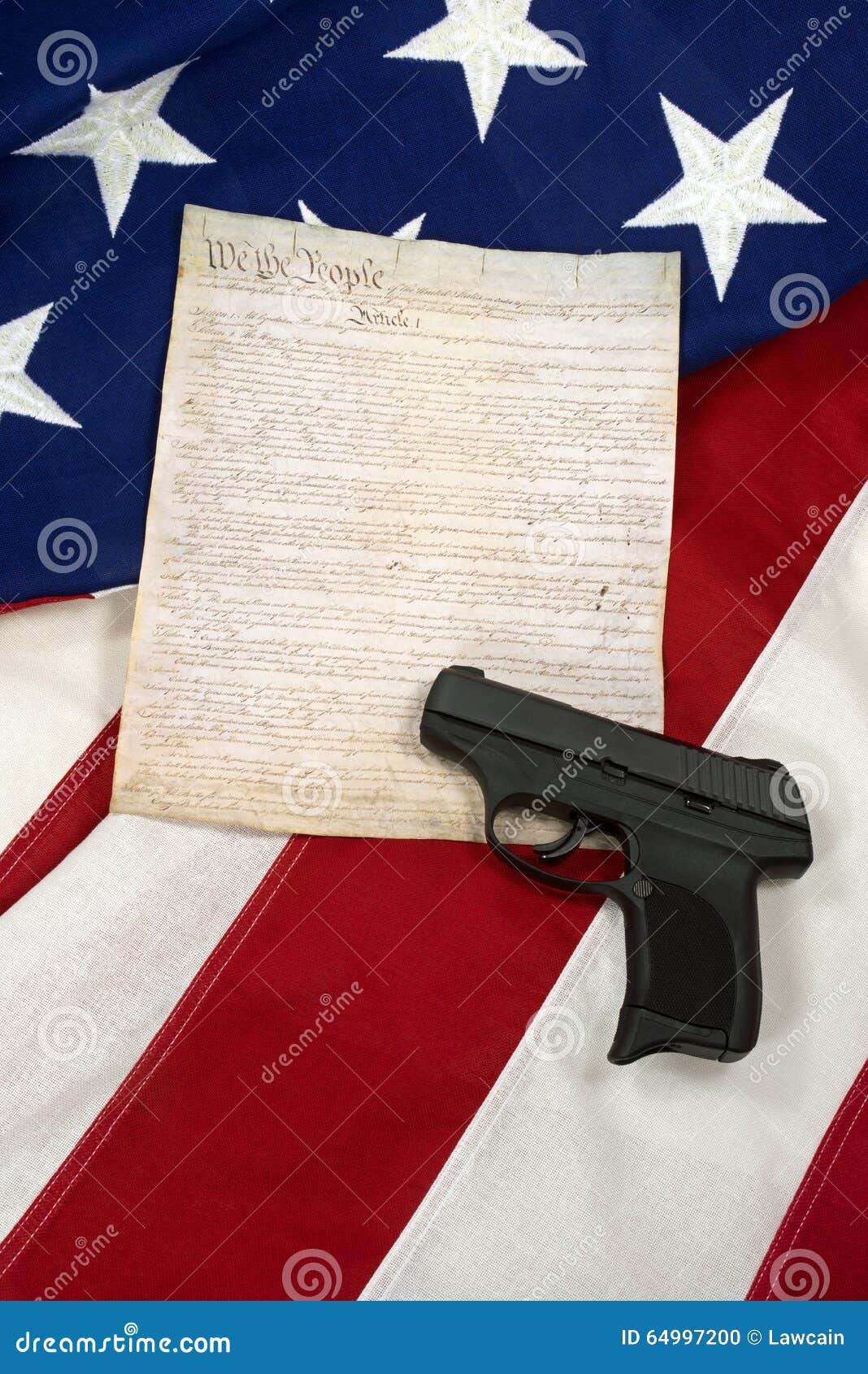 Constitution with Hand Gun on American Flag, Vertical Stock Photo
