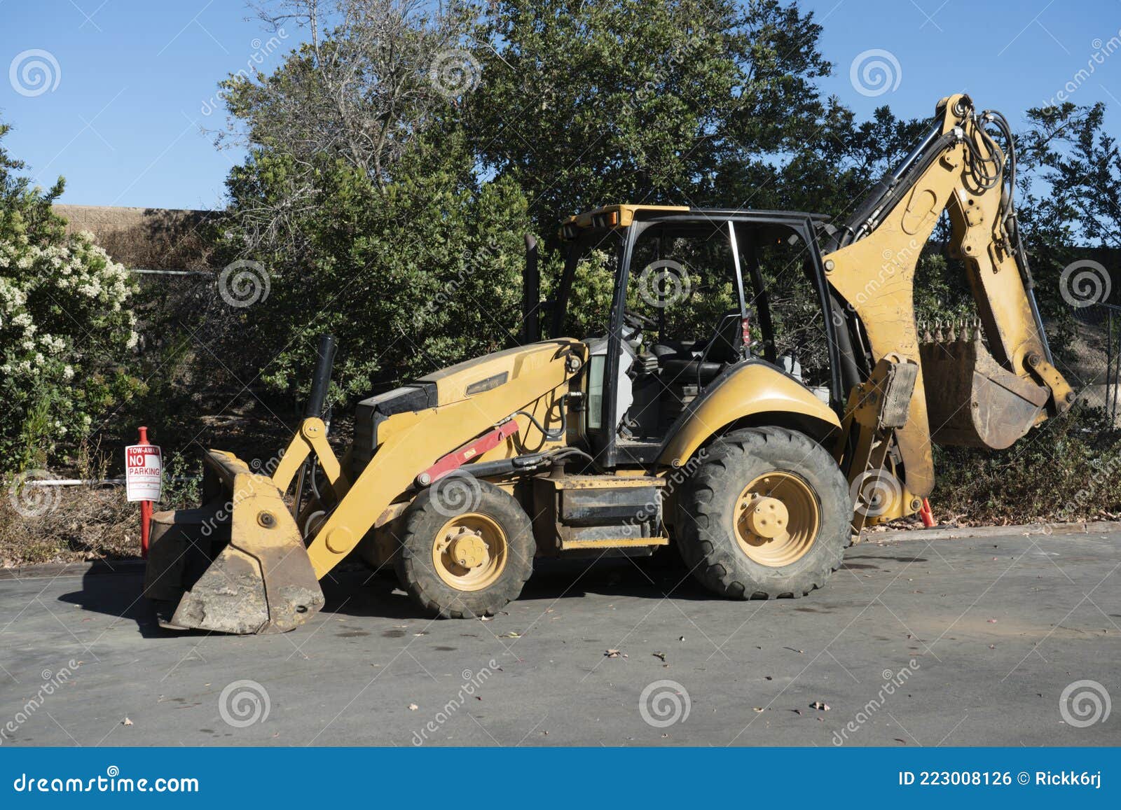 Construction Backhoe Loader Parked on Asphalt Lot. Stock Photo Image of yellow, sand 223008126