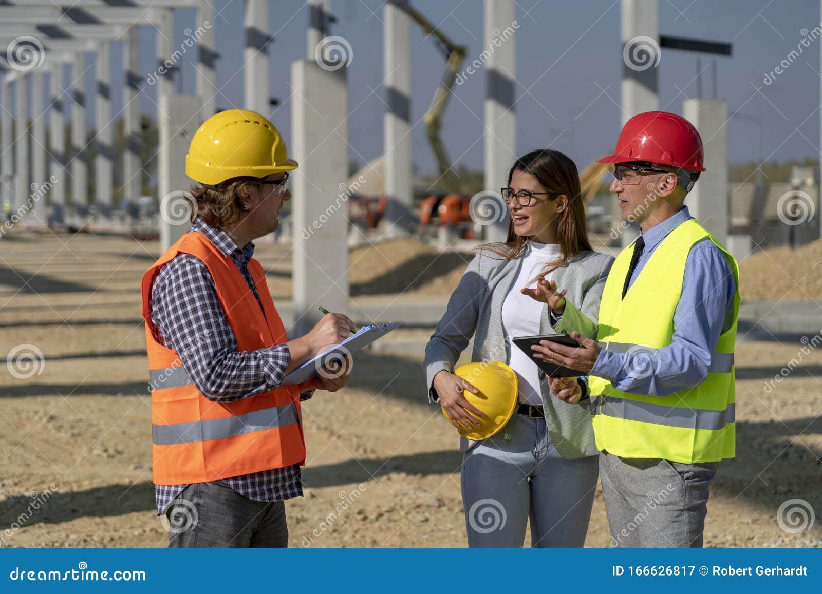 Construction Business Team Standing And Talking On Site Under