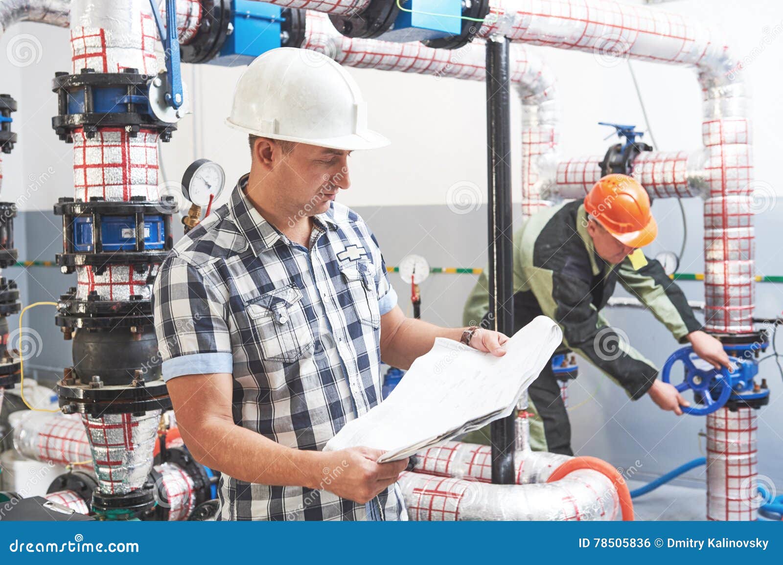 Construction Engineer Worker at Industrial Boiler Room Stock Photo