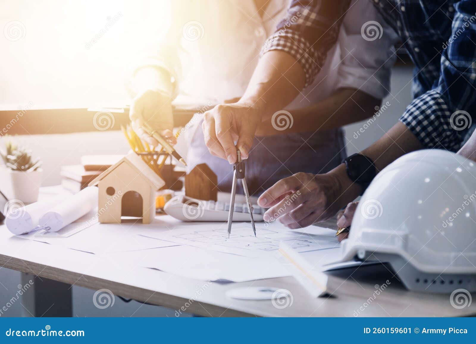 Construction Engineer Working at Blueprint To Build Large Commercial