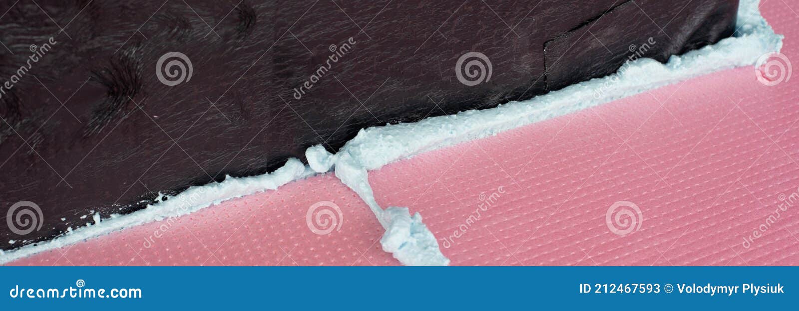 Construction Foam between Pink Extruded Styrofoam Sheets Stock Image
