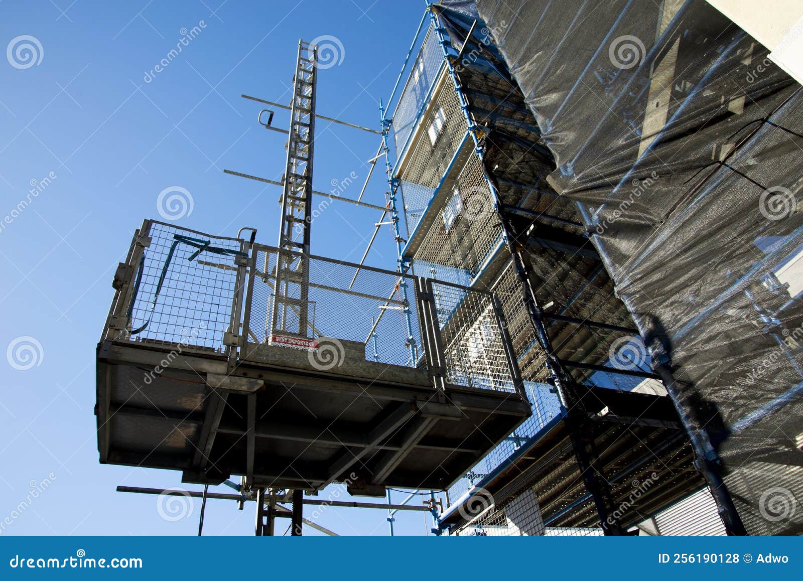 Construction Hoist editorial stock photo. Image of platform 256190128