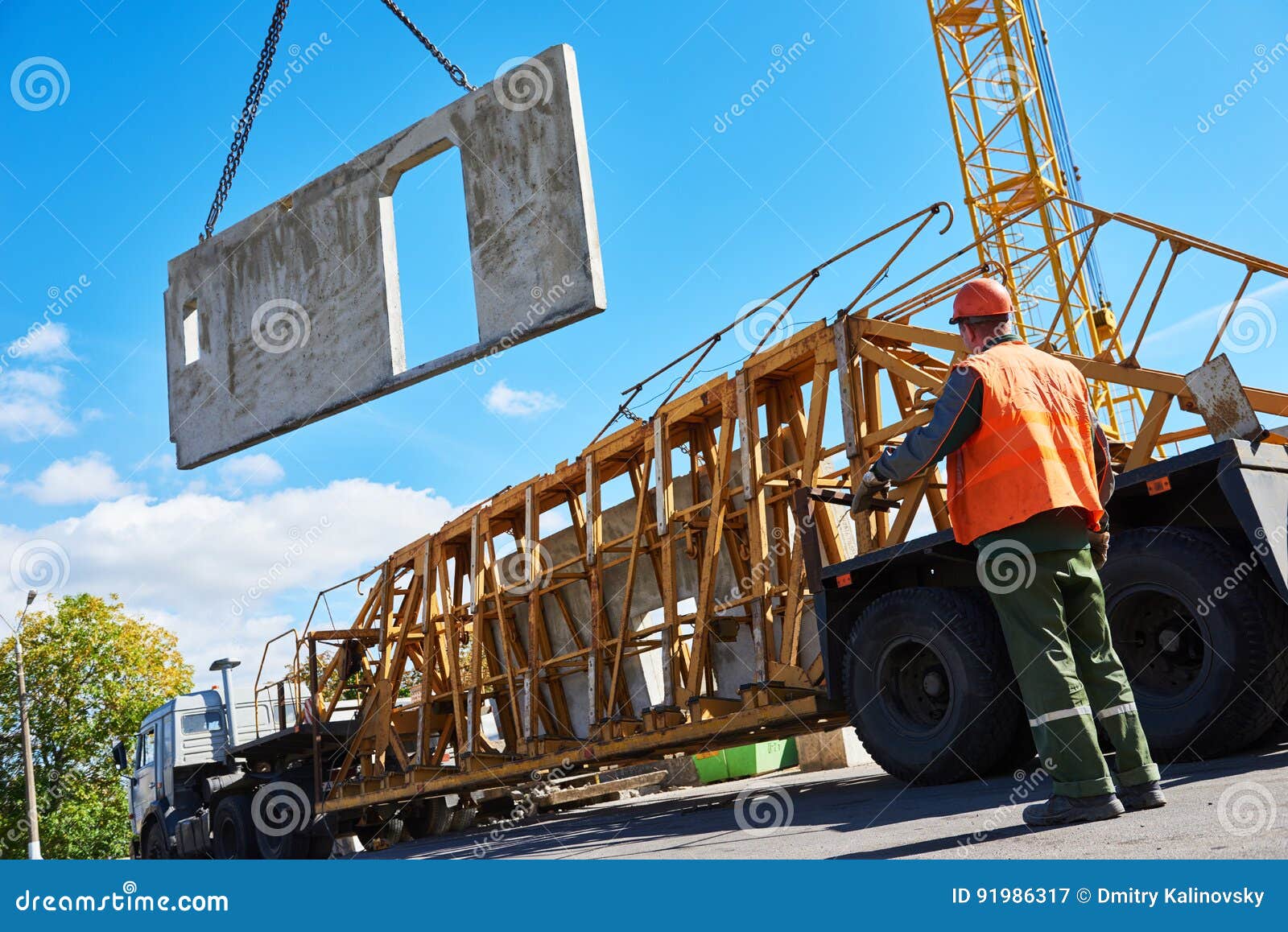 construction industrial worker operating hoisting process of concrete slab