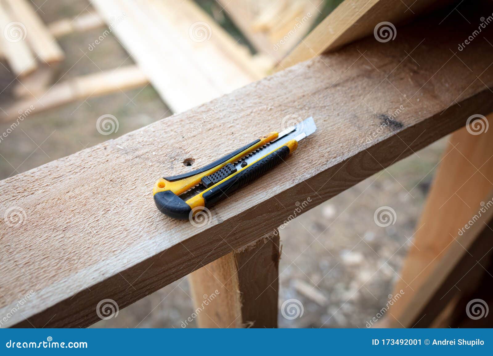 A Construction Knife in the Hand of a Worker Stock Image Image of