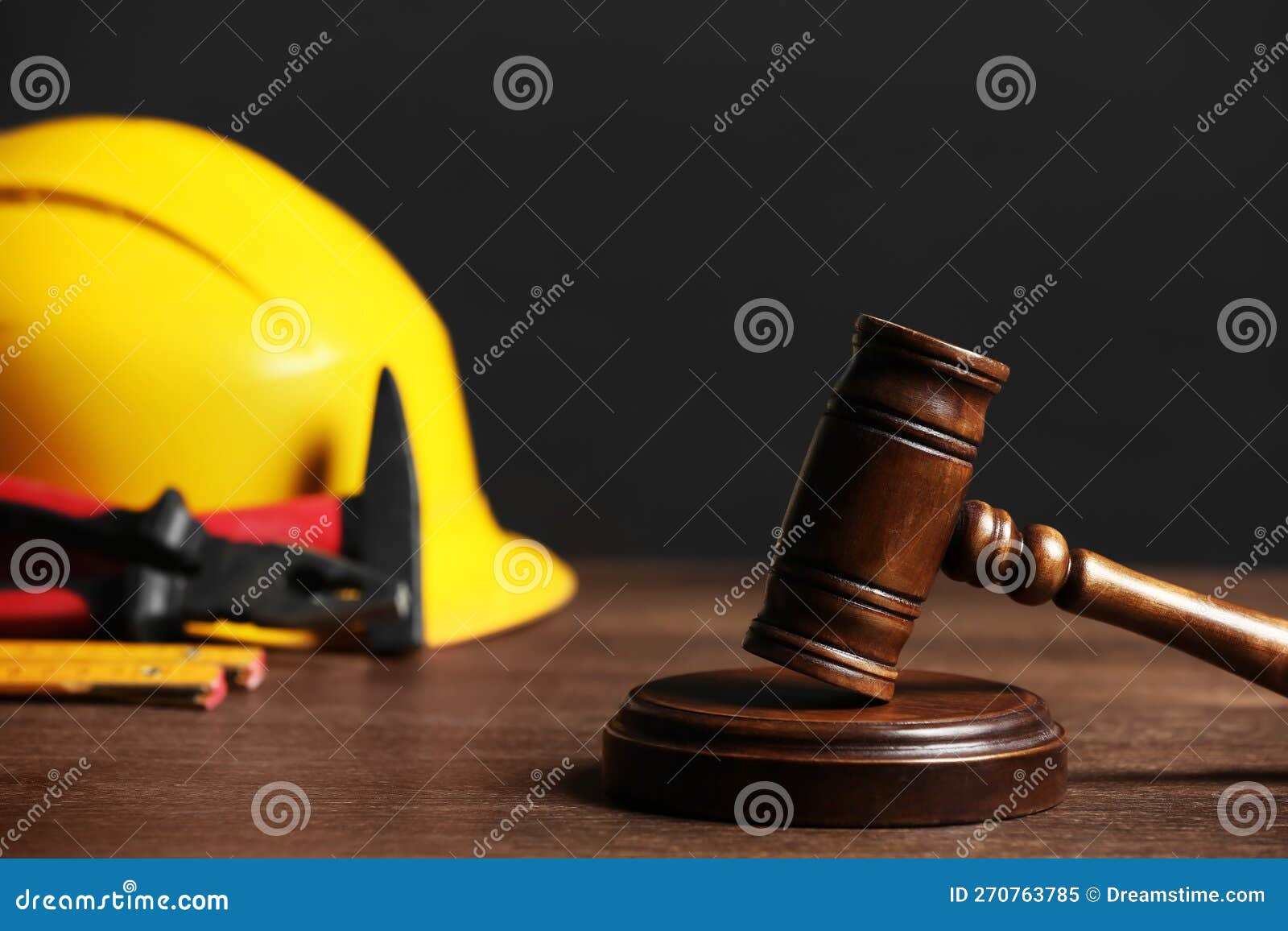 Construction and Land Law Concepts. Gavel, Hard Hat and Different Tools
