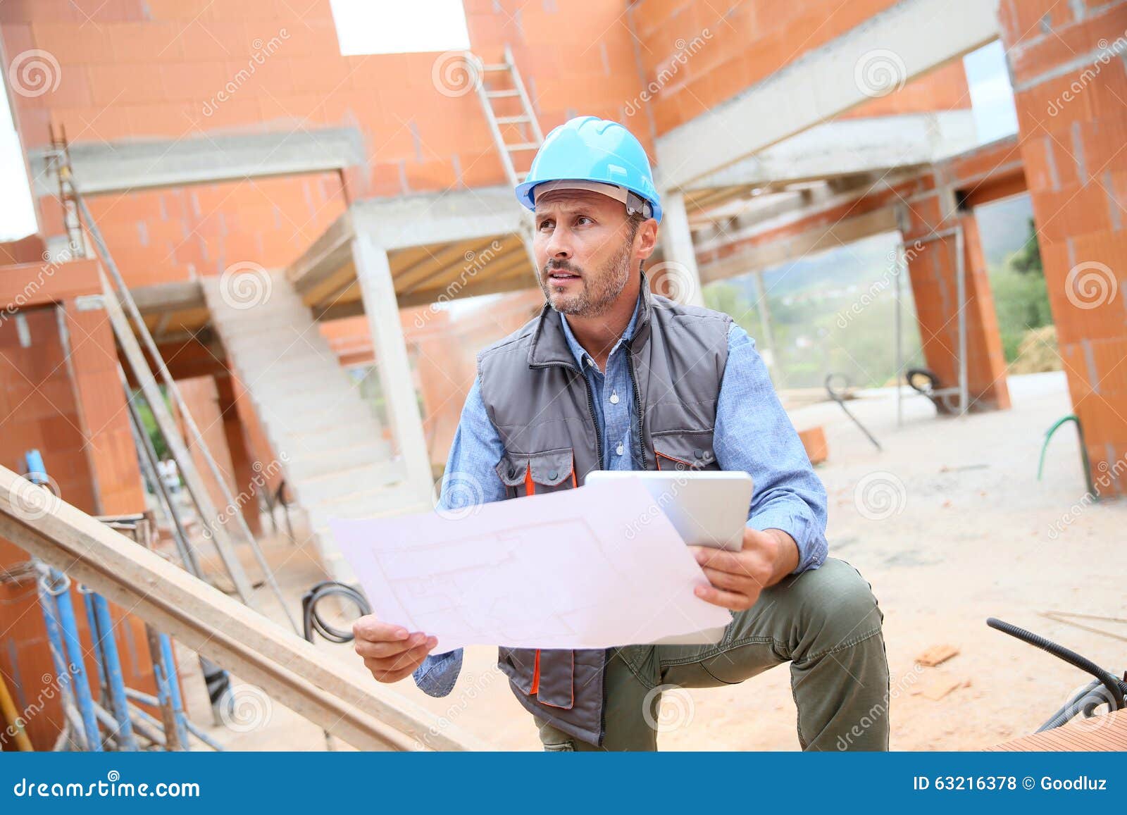 Construction Manager with Blueprint Stock Photo Image of controlling