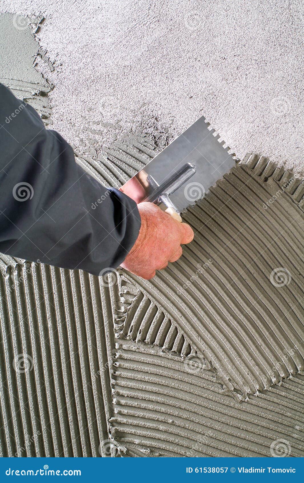 Construction Notched Trowel with Grey Cement Mortar for Tiles Work