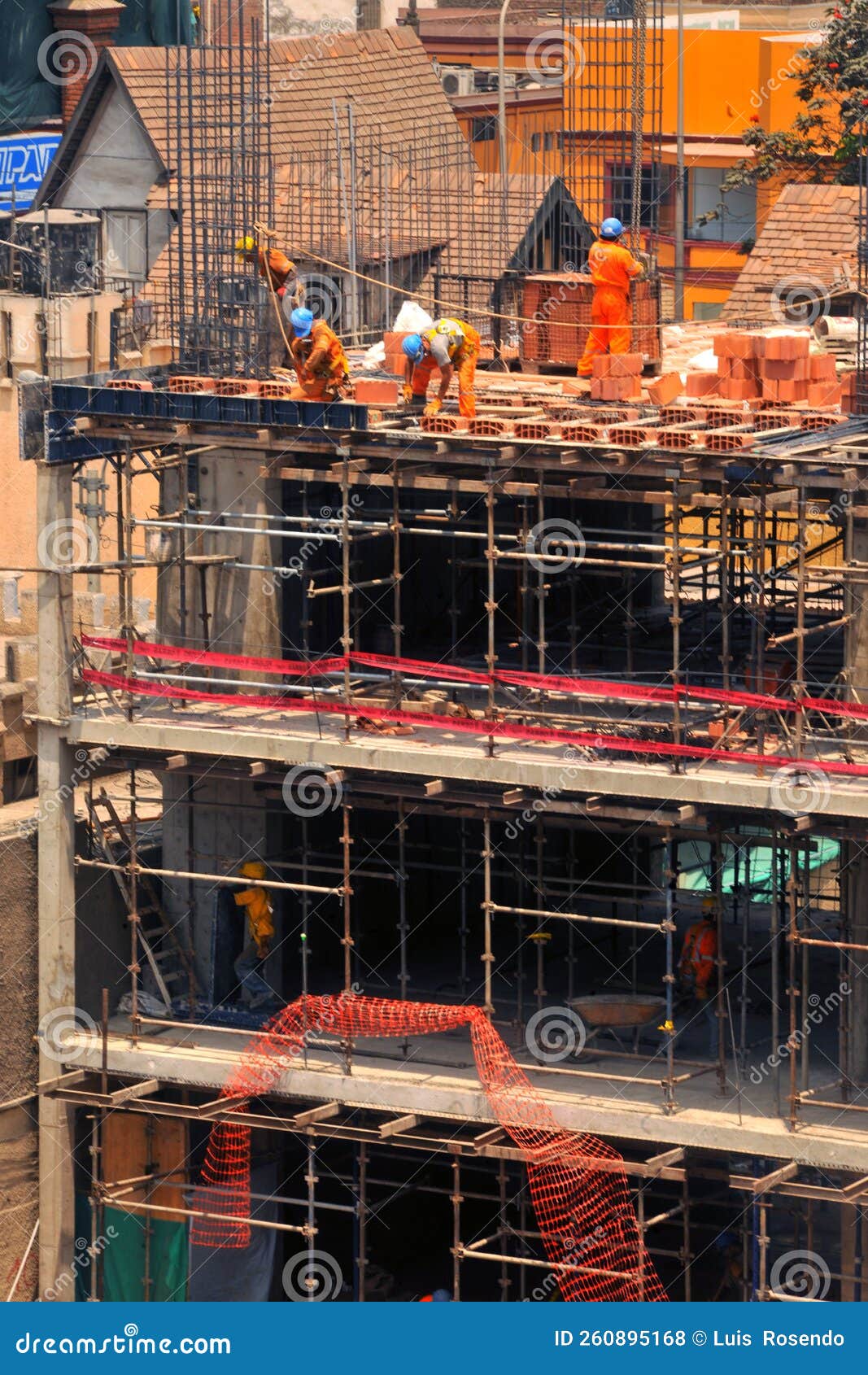 Construction of Office and Apartment Buildings with Engineer Workers Working on Floor and Column
