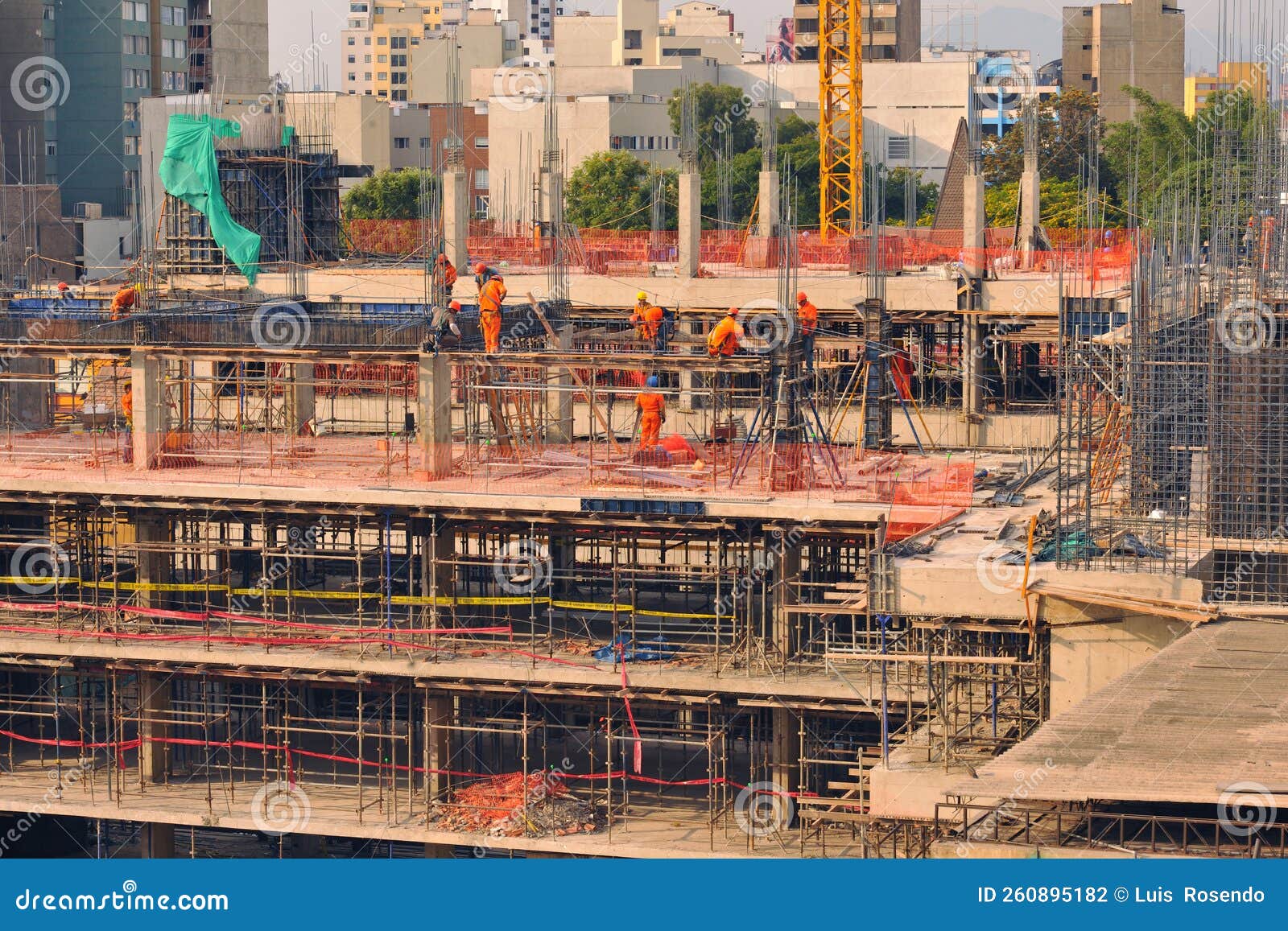 Construction of Office and Apartment Buildings with Engineer Workers Working on Floor and Column