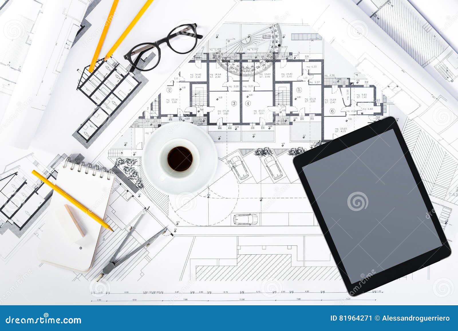 Construction Plans with Tablet and Drawing Tools on Blueprints Stock