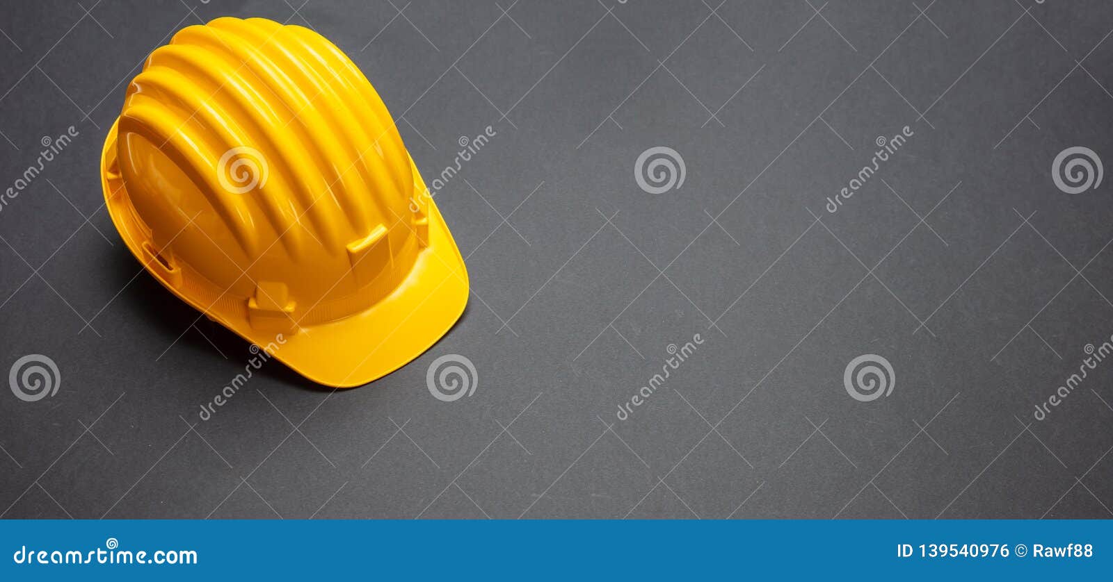 construction project safety, yellow hard hat on black color background