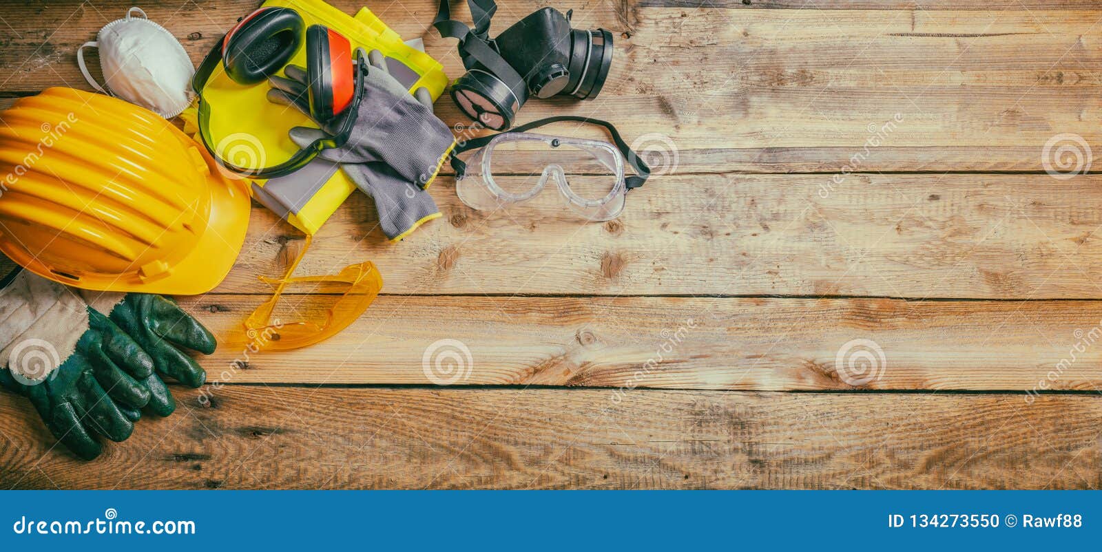 construction safety. protective hard hat, headphones, gloves and glasses on wooden background, banner