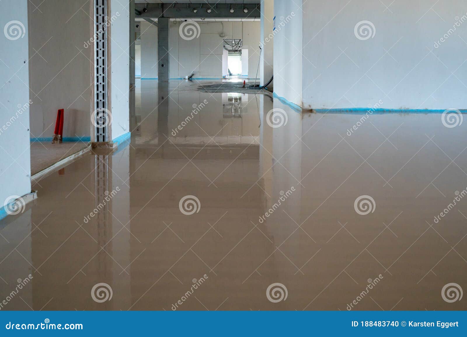 On Construction Site the Liquid Screed Was Poured on the Ground Stock