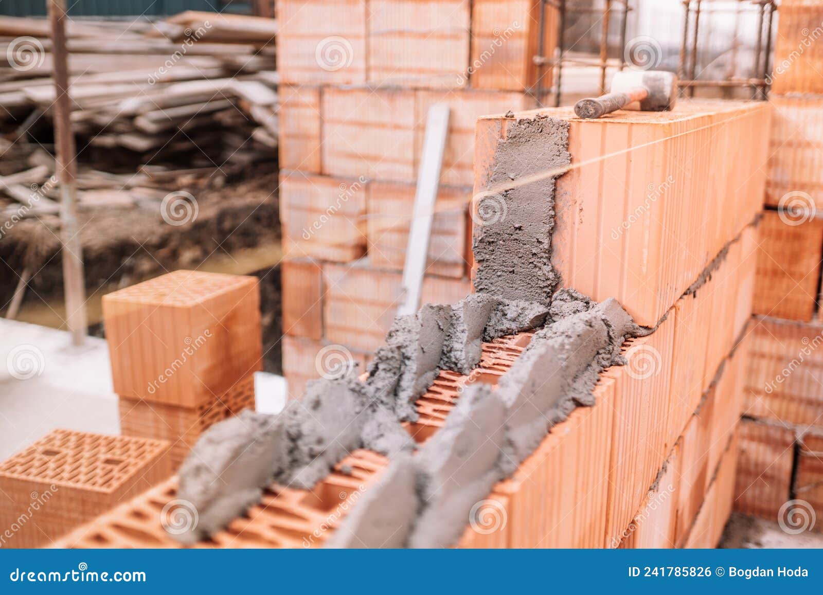 Construction Site of New House, Worker Building the Brick Wall with Trowel Stock Photo Image