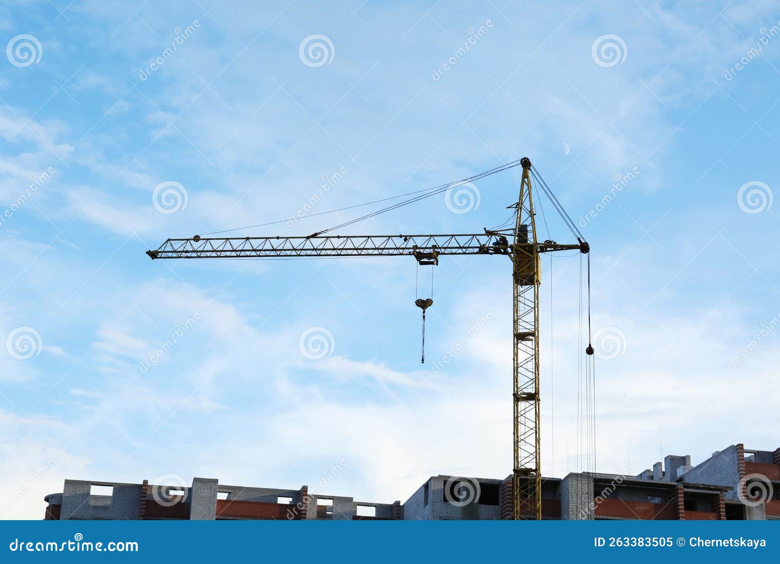 Construction Site with Tower Crane Near Unfinished Building Stock Image