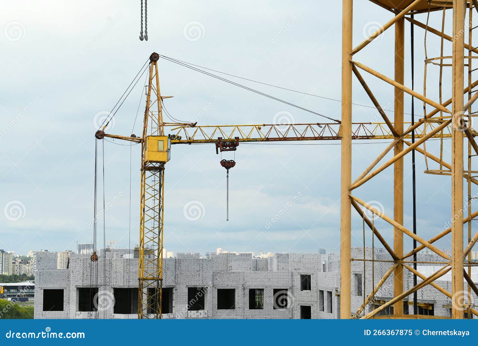 Construction Site with Tower Crane Near Unfinished Building Stock Image