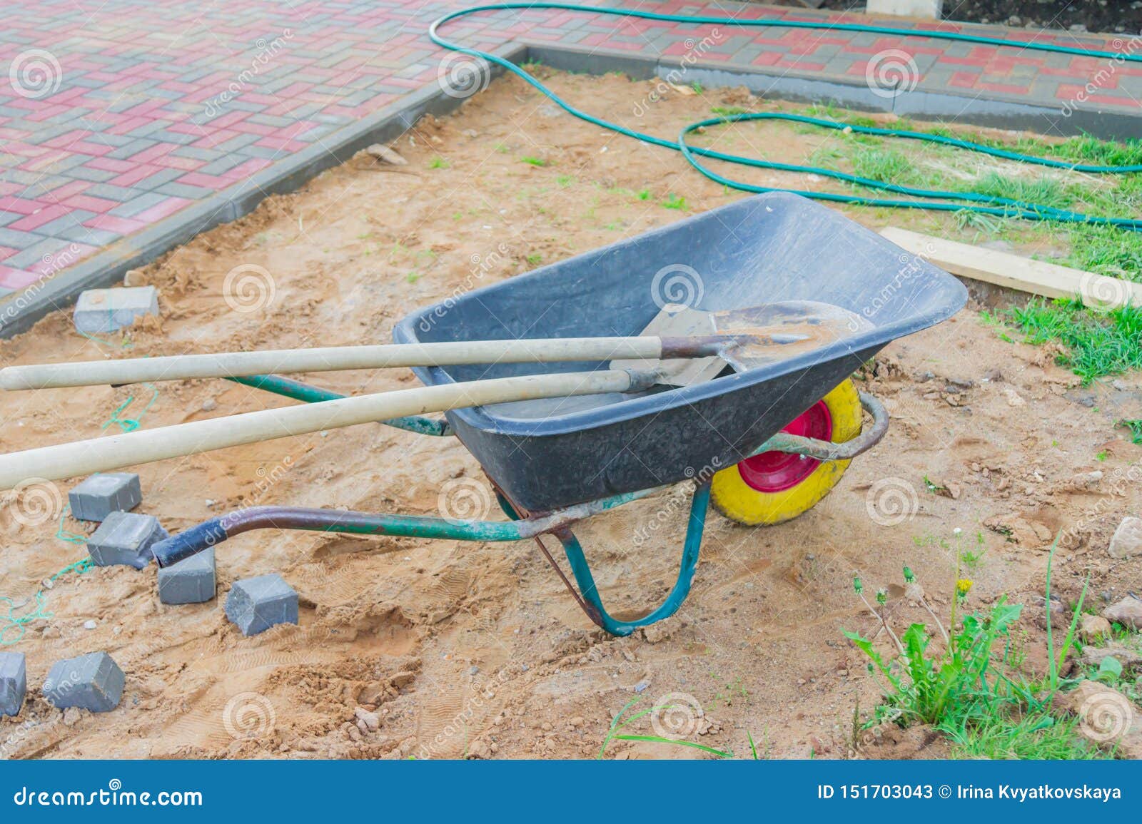 Construction Site with Wheel Barrow and Spades Stock Image Image of