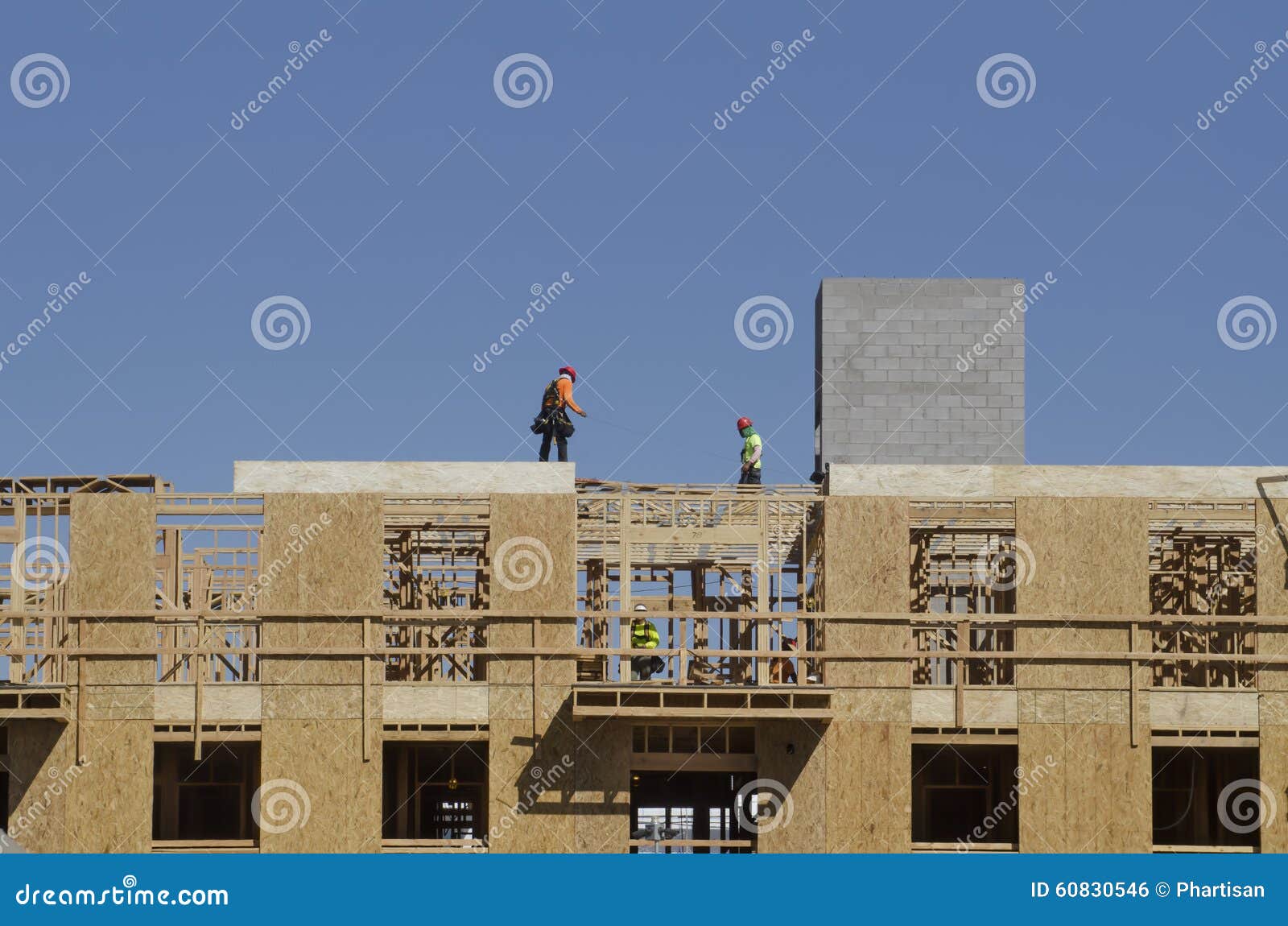 Construction Site Workers Building Roof on Apartment Complex Stock Photo Image of advertising