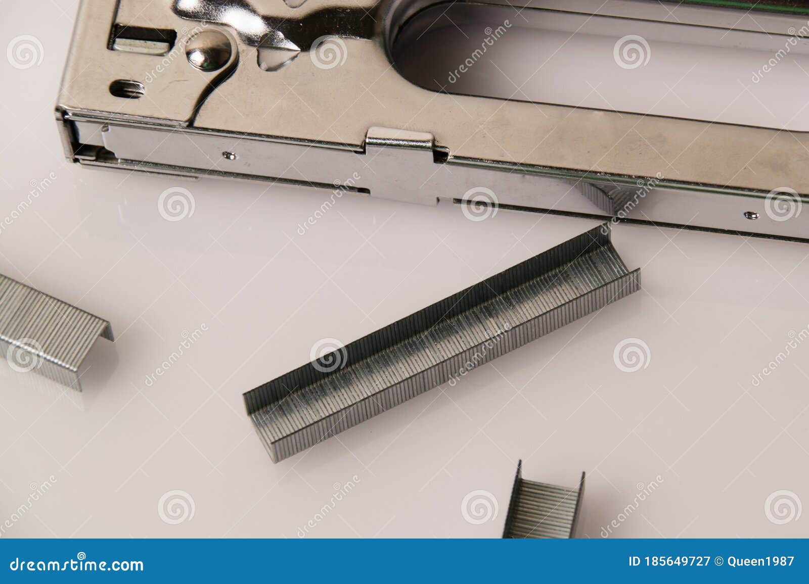 Construction Stapler and Staples on a Light Background with Copy Space. the Concept of