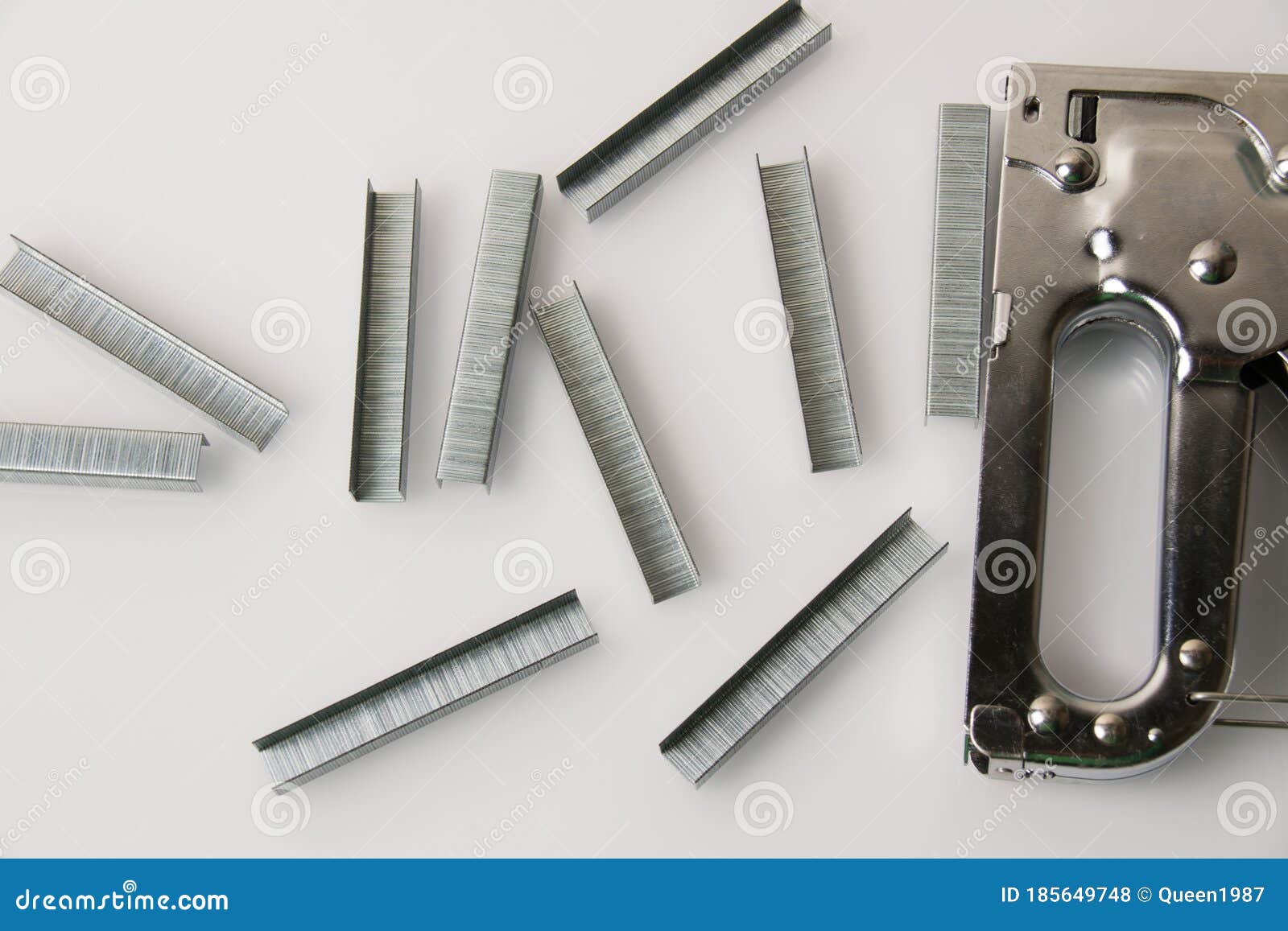 Construction Stapler and Staples on a Light Background with Copy Space. the Concept of
