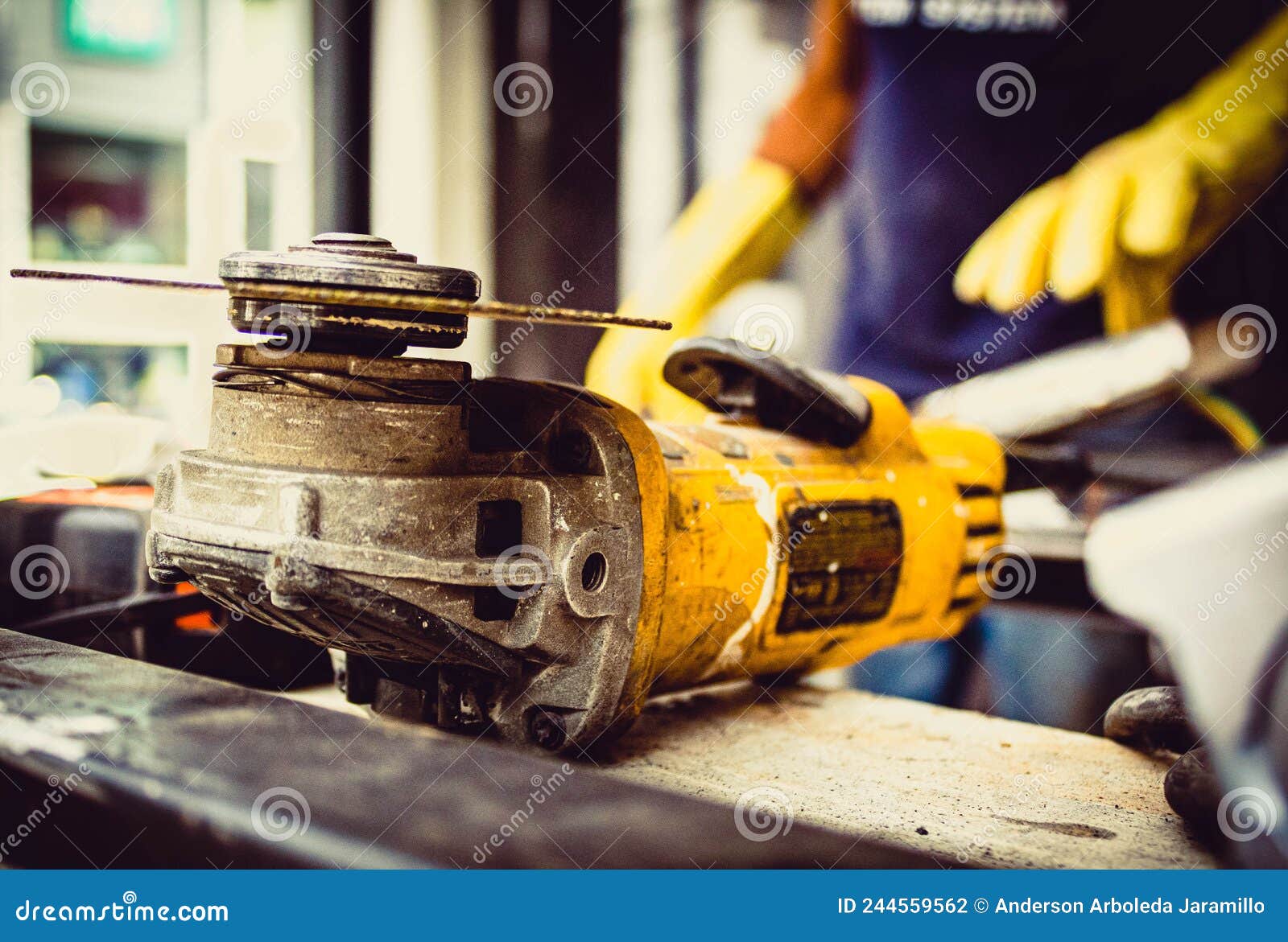 construction tool with man behind welding