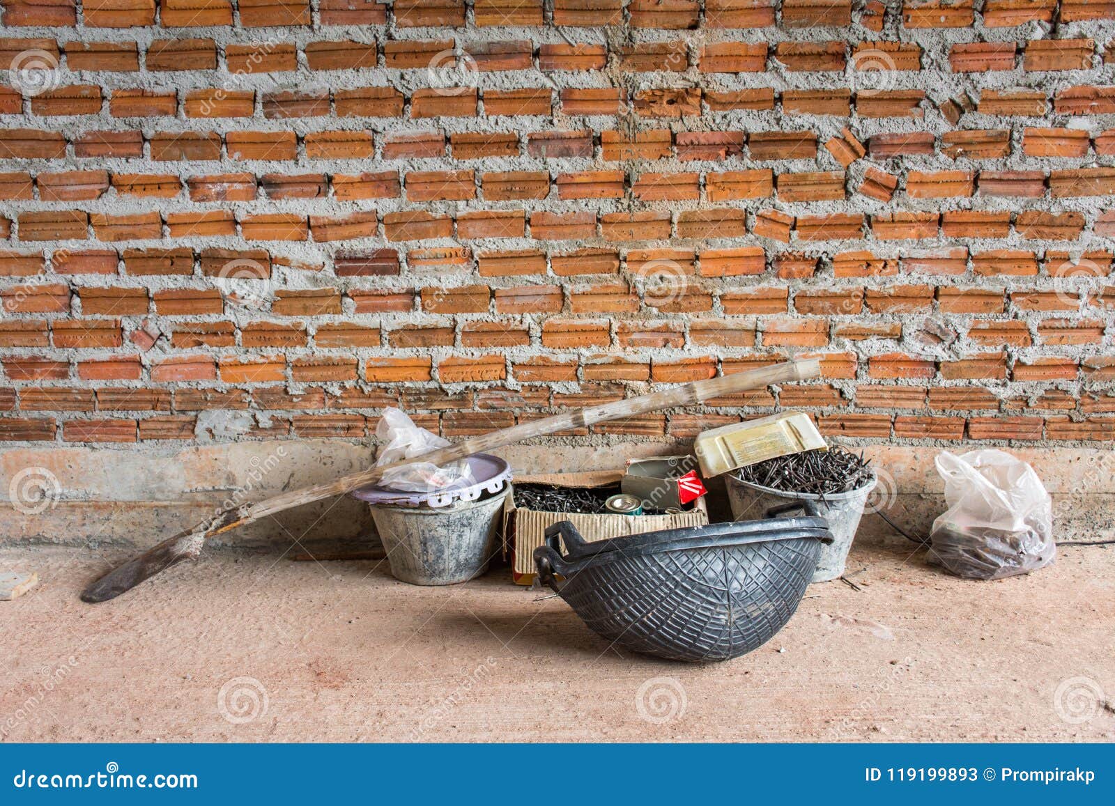 Construction Tools Put on Concrete Floor Near Brick Wall Under C Stock