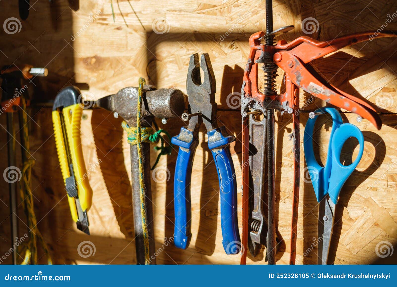 Construction Tools on a Wall in a the Setting Sun Illuminates
