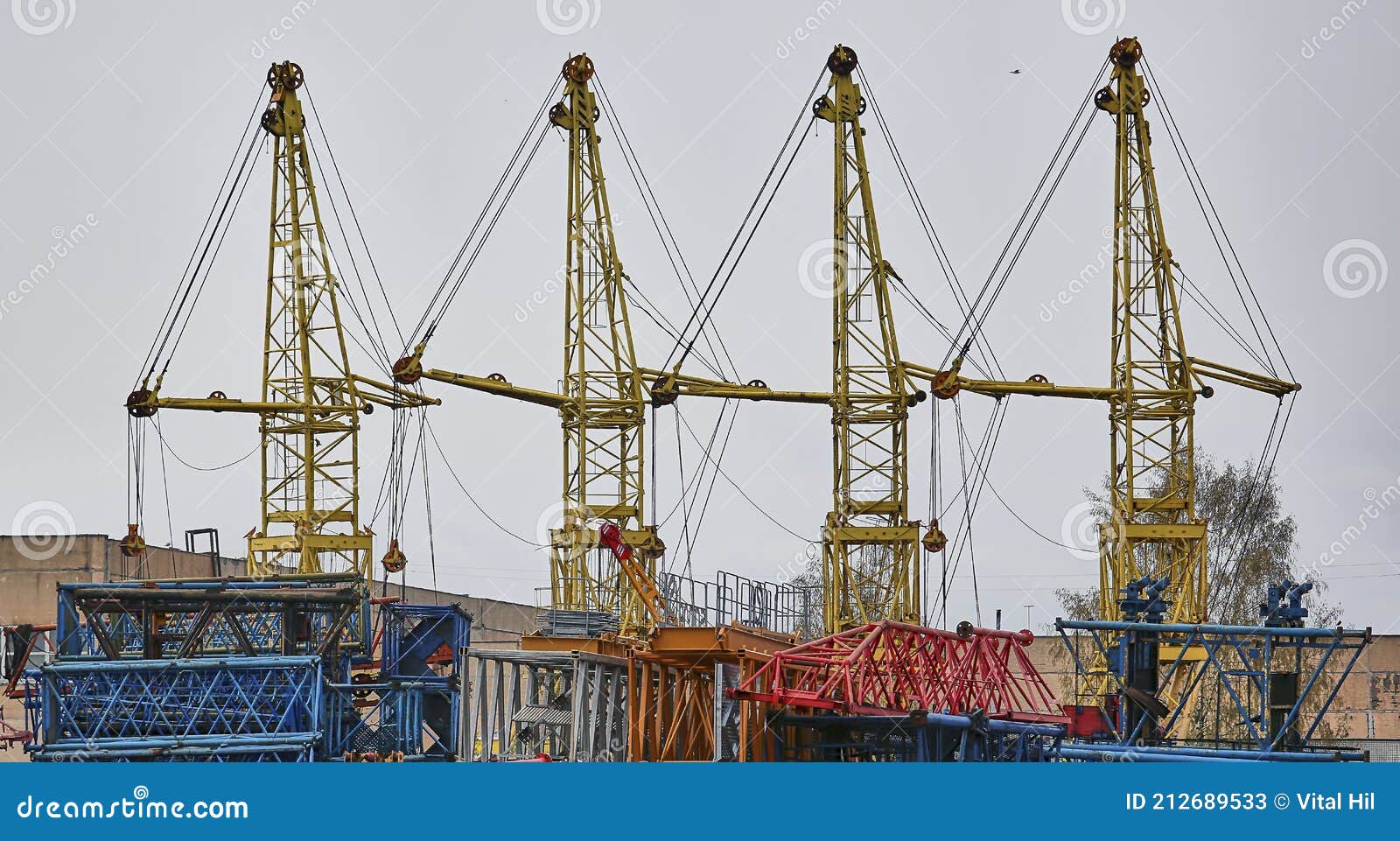 Construction Tower Cranes in Disassembled Form are on the Construction Site. Editorial Stock