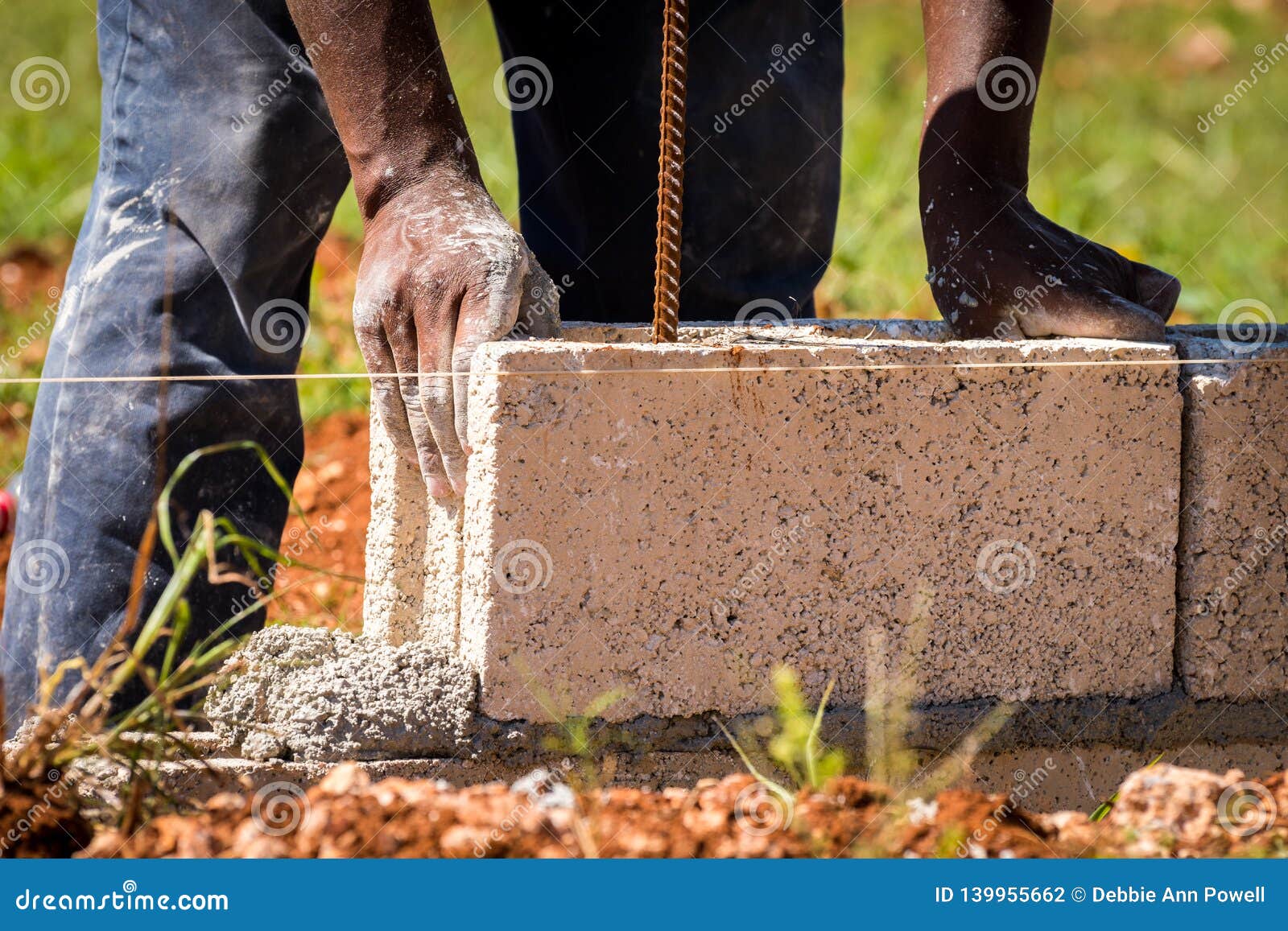 Construction Worker/bricklayer/mason Laying Concrete Block on Wet