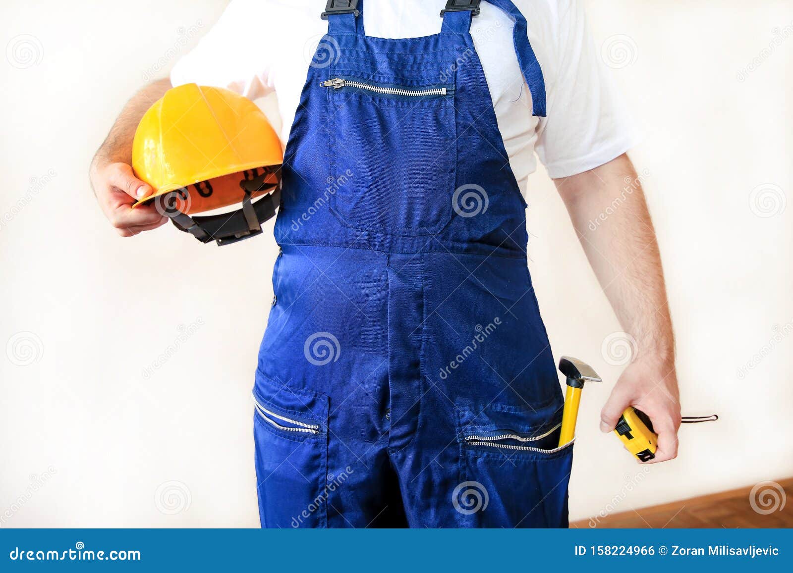 Construction Worker at Construction Site with Protective Uniform