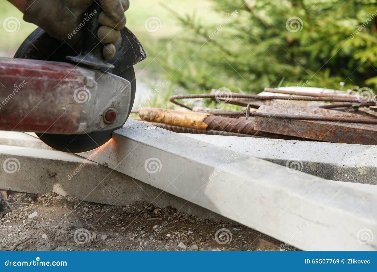 Construction Worker Cutting a Reinforced Concrete Pillar Stock Image