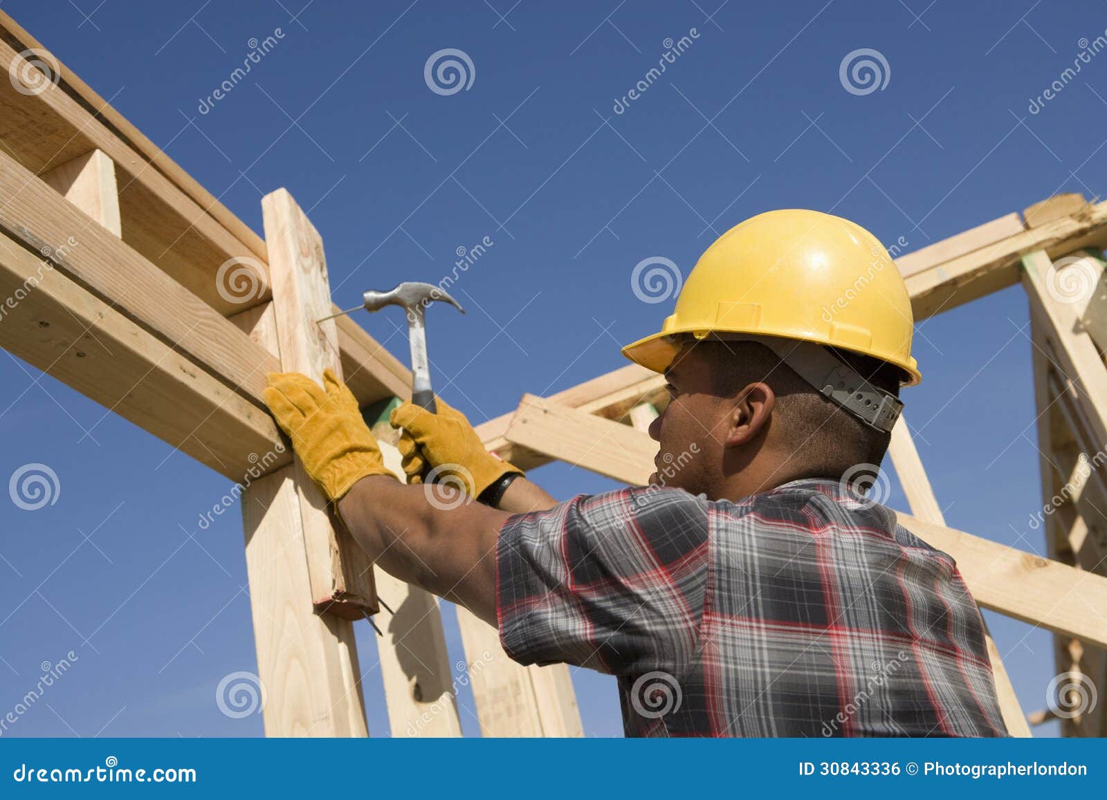 Construction Worker Hammering Nail on Timber Frame Stock Photo Image