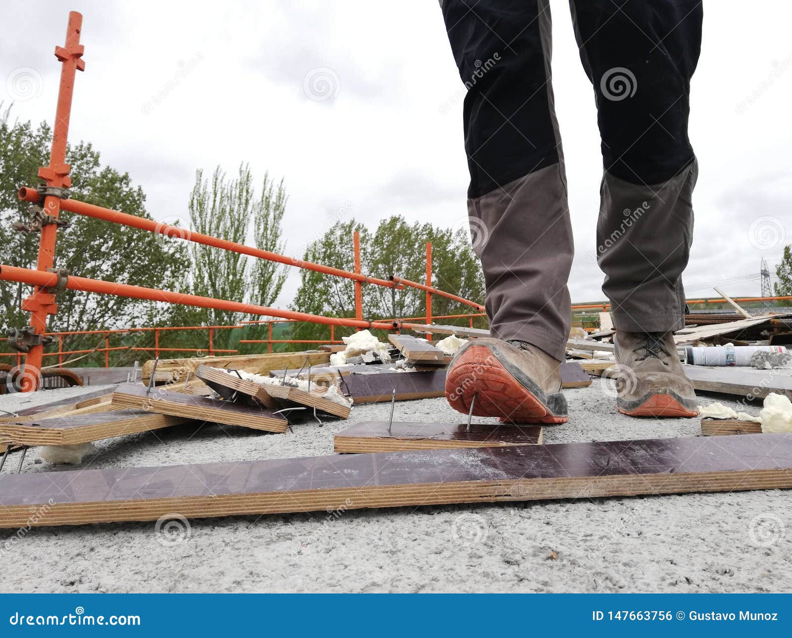 A Construction Worker Has an Accident while Walks through a Site with