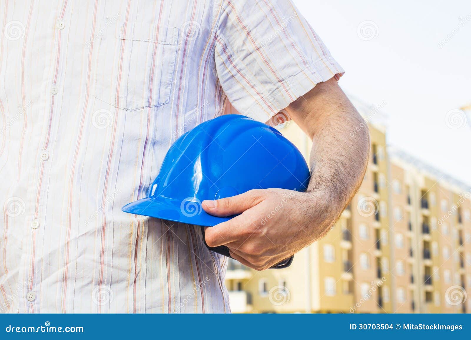 Construction Worker Holding Blue Hard Hat Stock Photo Image of worker, development 30703504