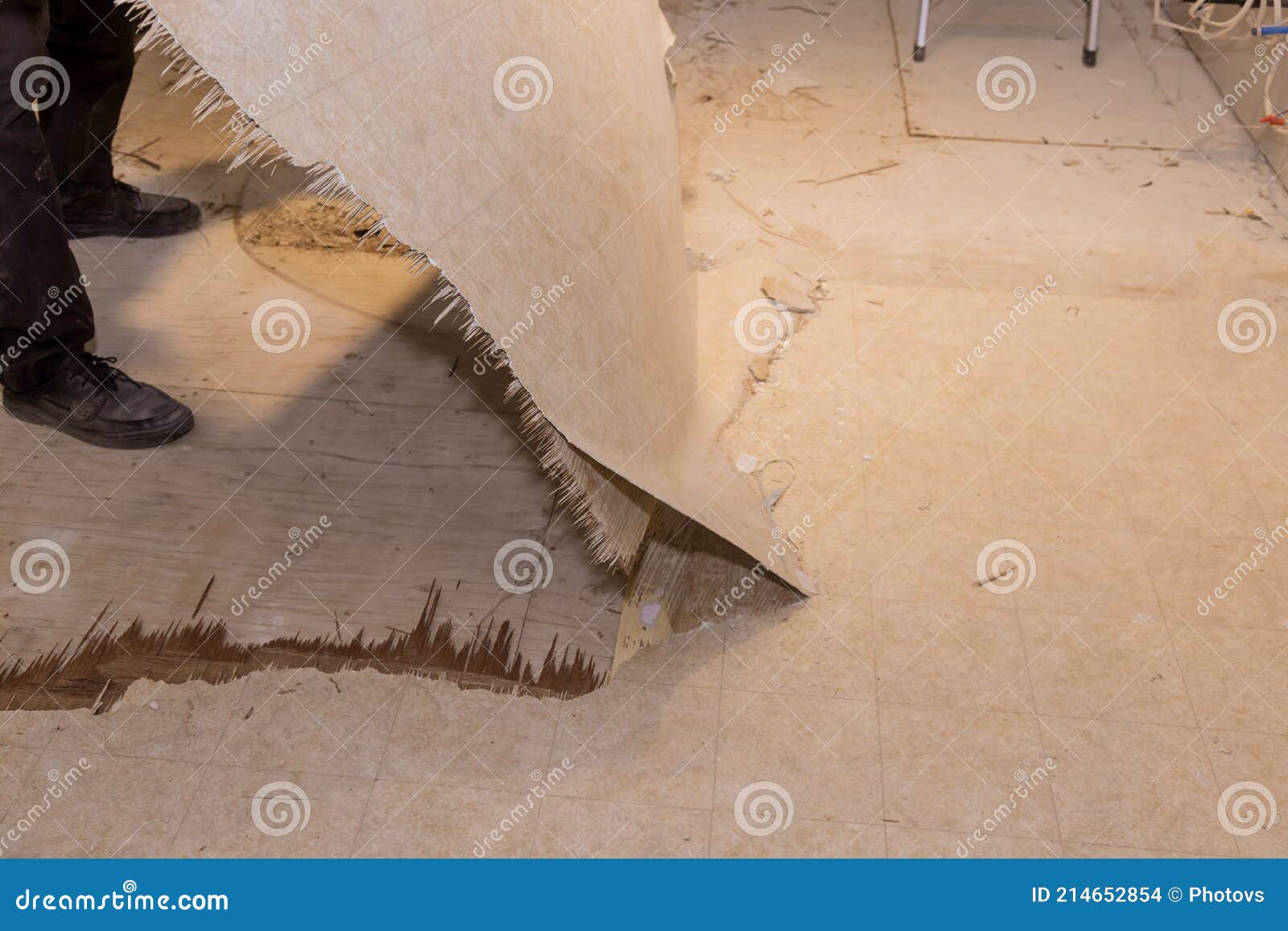 Construction Worker Remove Old Laminate Floor for Repairing and