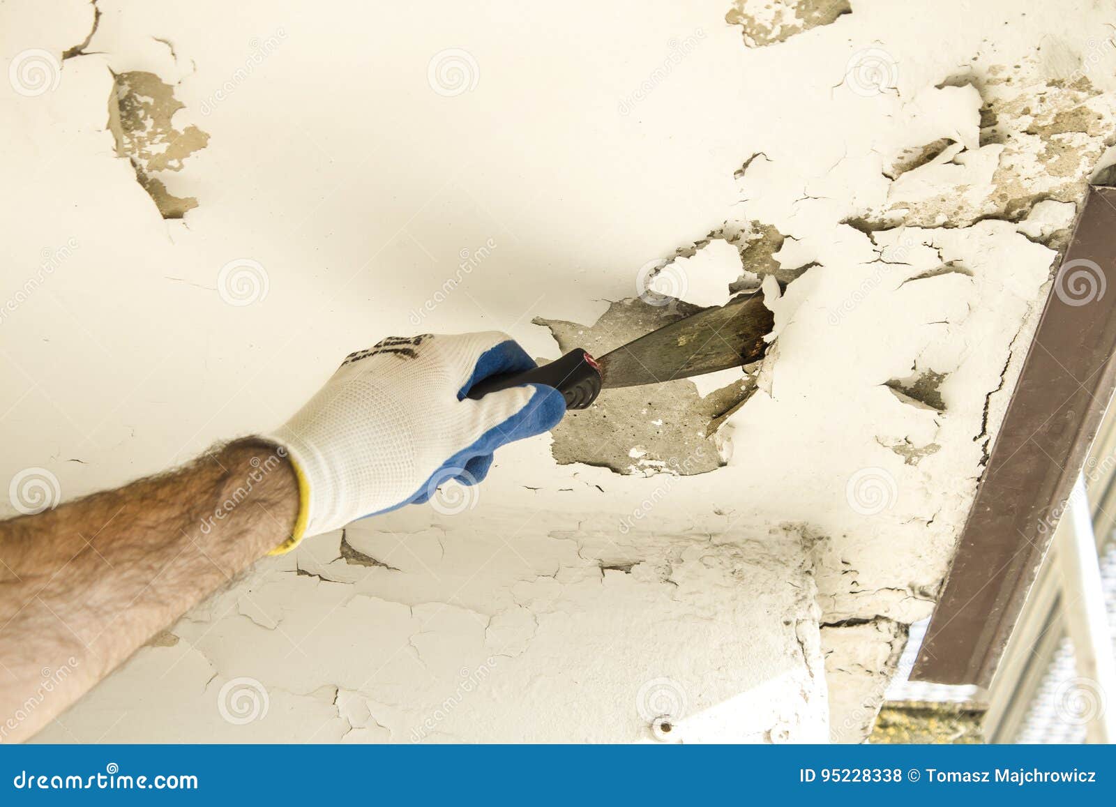 The Construction Worker S Hand In The Protective Glove Removes The