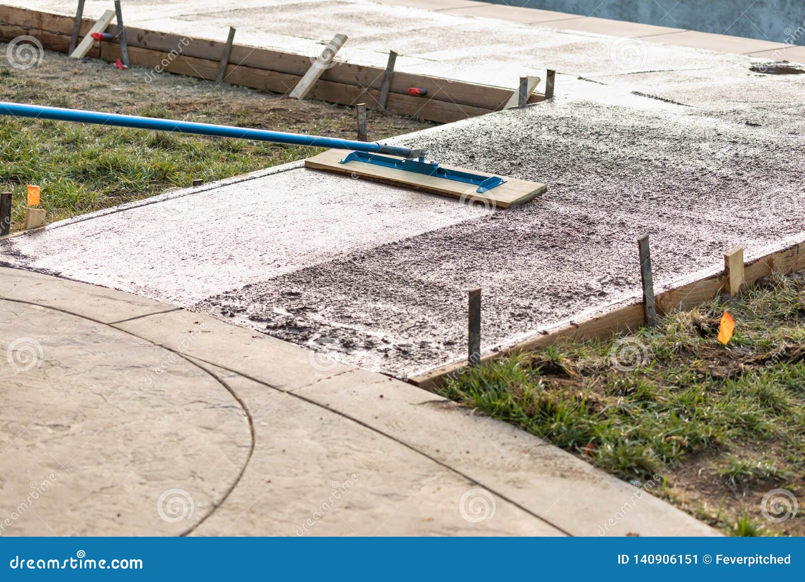 Construction Worker Smoothing Wet Cement with Trowel Tool Stock Image