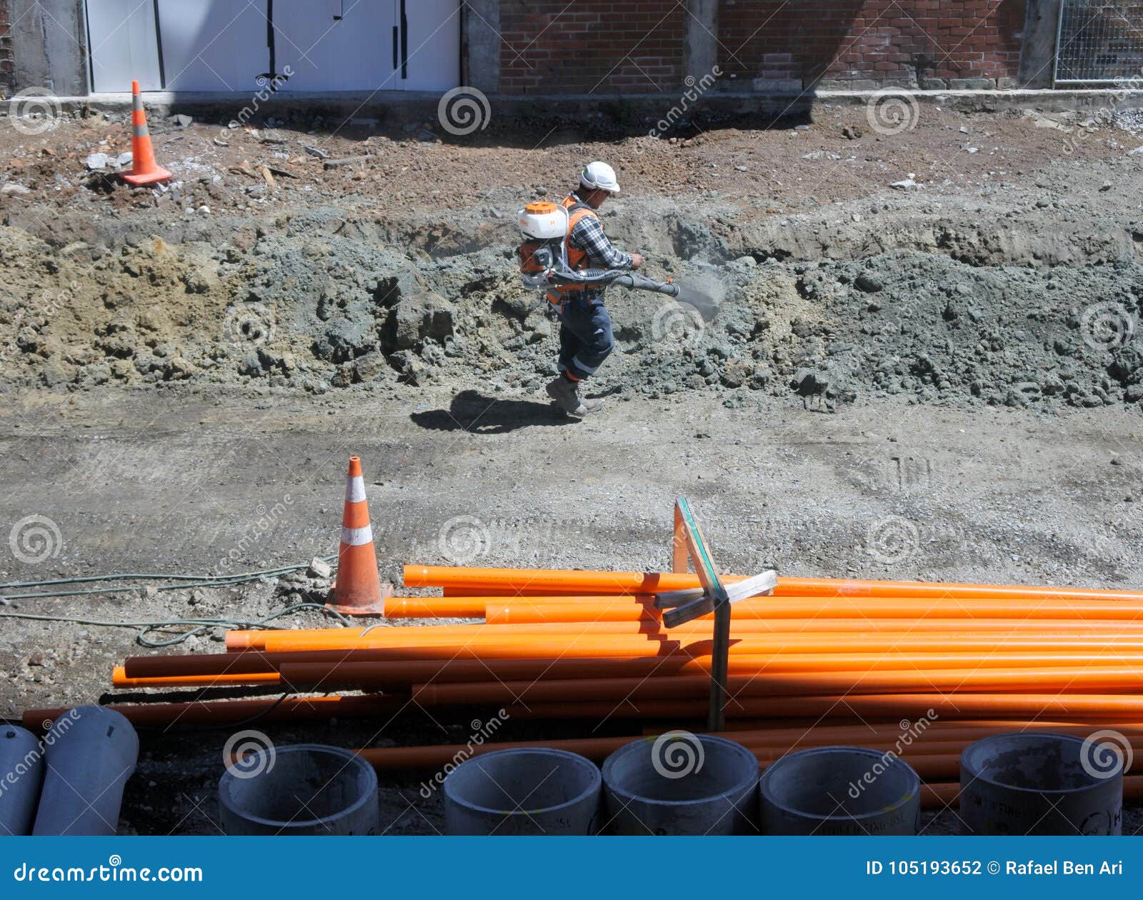 Construction Worker Spray Water on Cement Editorial Photography Image