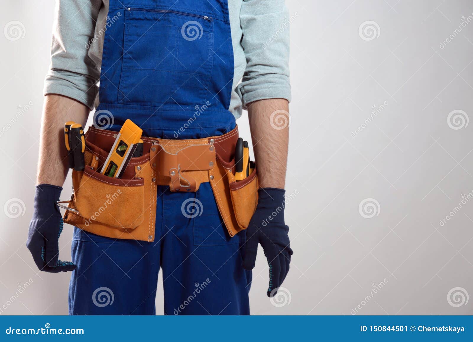 Construction Worker with Tool Belt, Closeup. Space for Text Stock Image