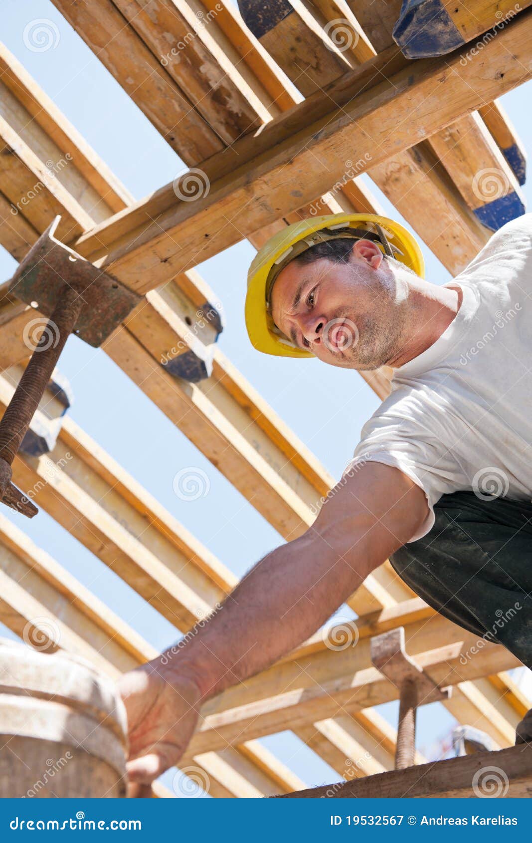 construction worker under formwork girders